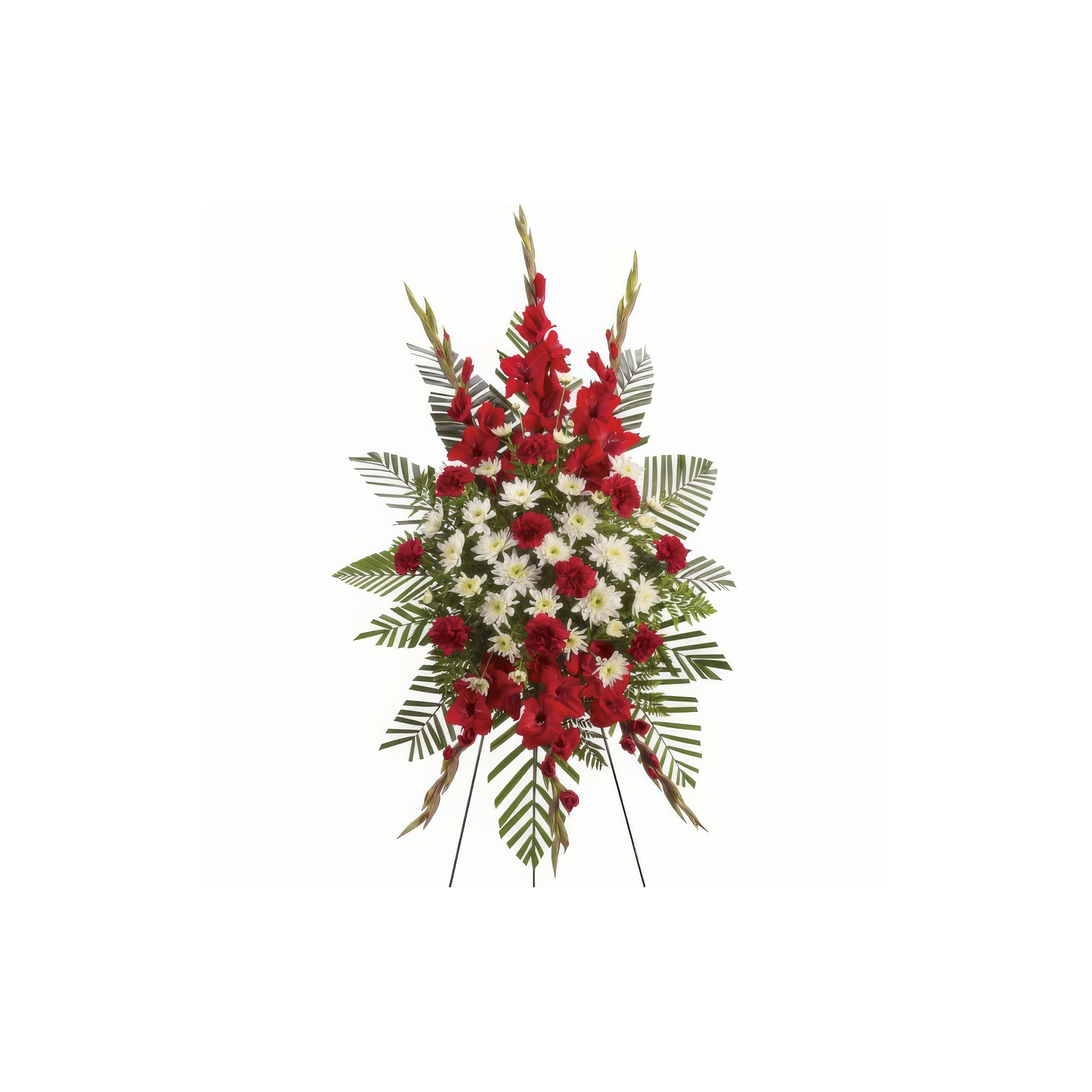 Vibrant floral tribute designed with red and white blossoms surrounded by lush greenery.