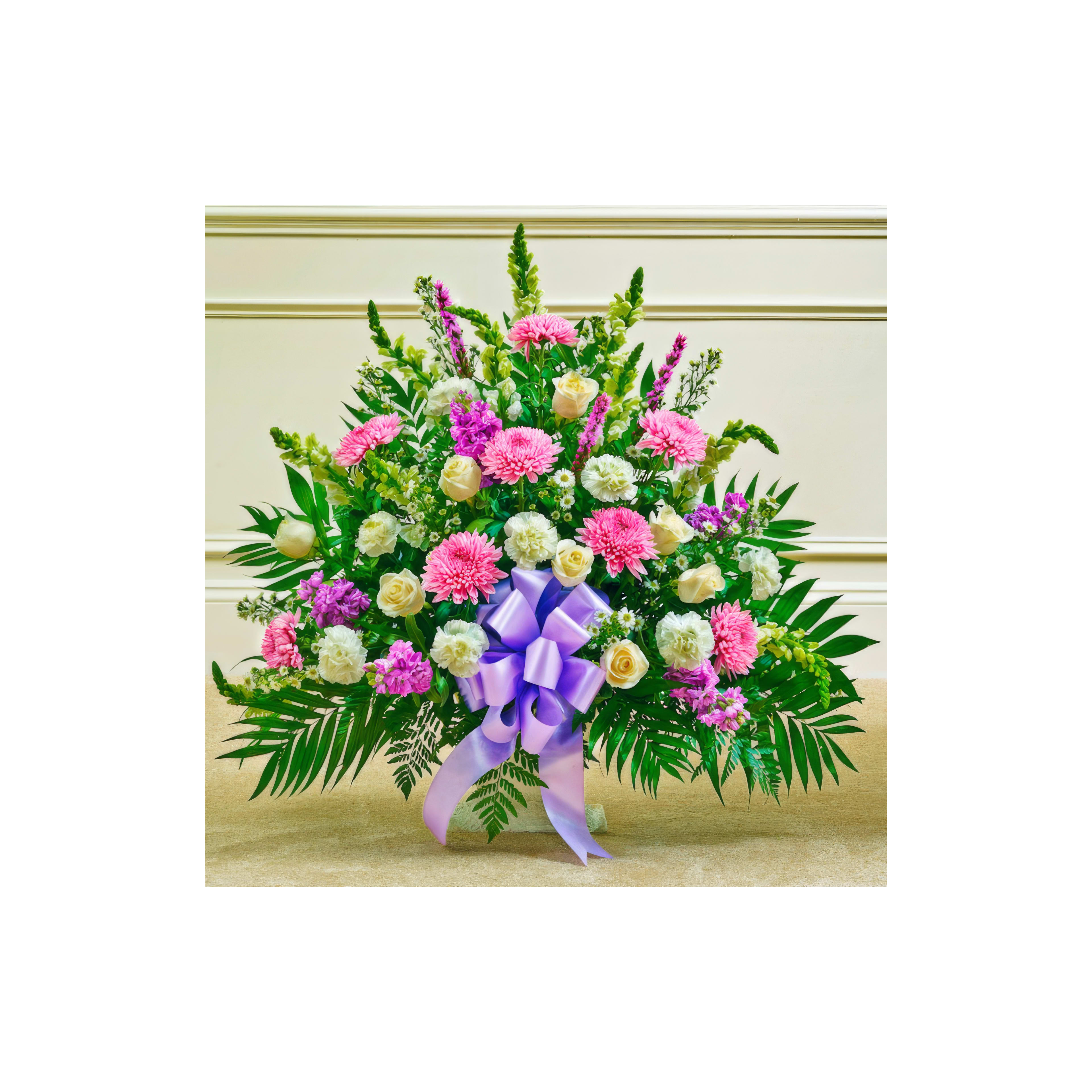 A vibrant arrangement of pink and white flowers with greenery, great for celebrations.