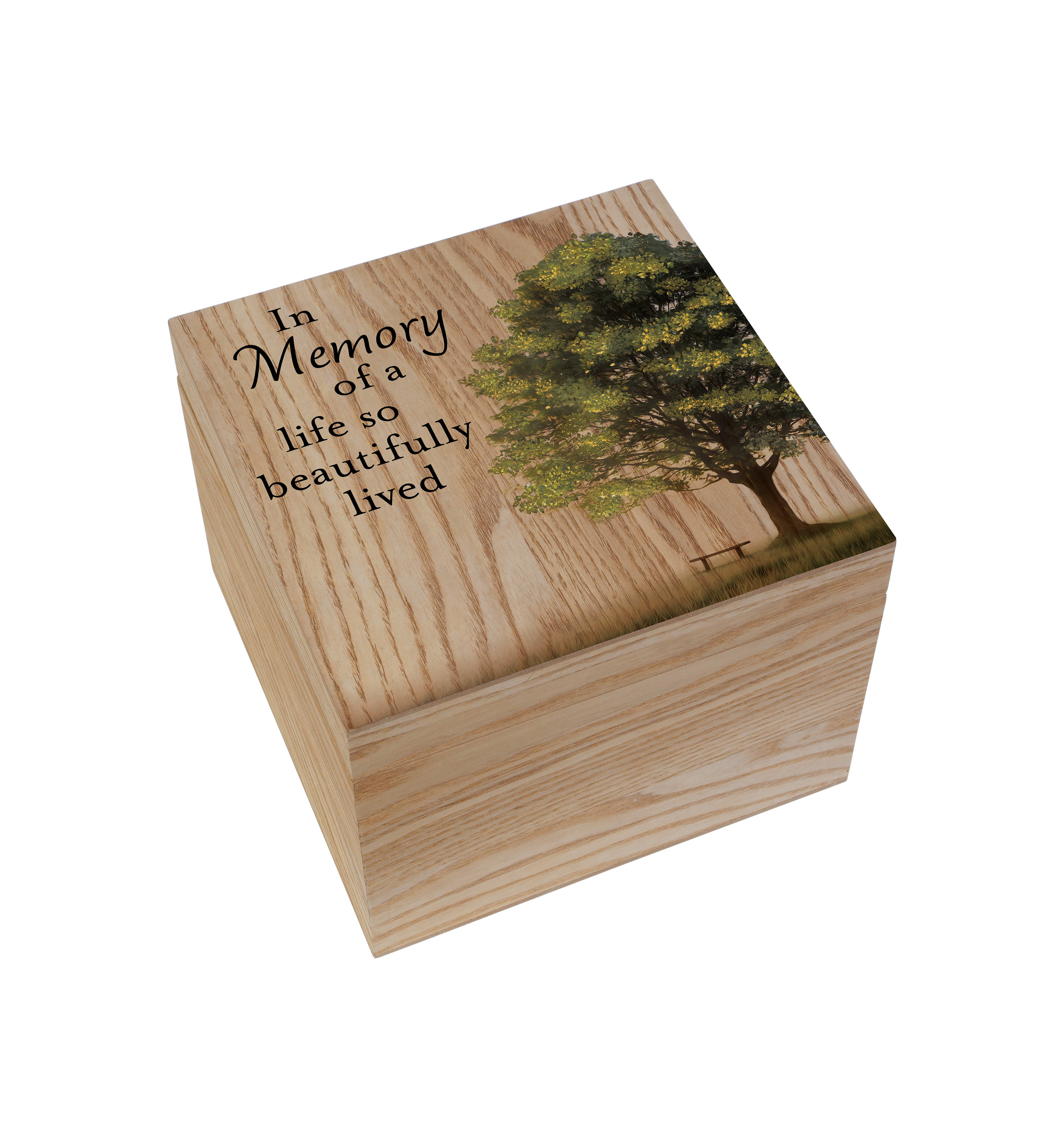 A wooden memory box features a heartfelt message and artistic tree design, symbolizing remembrance.