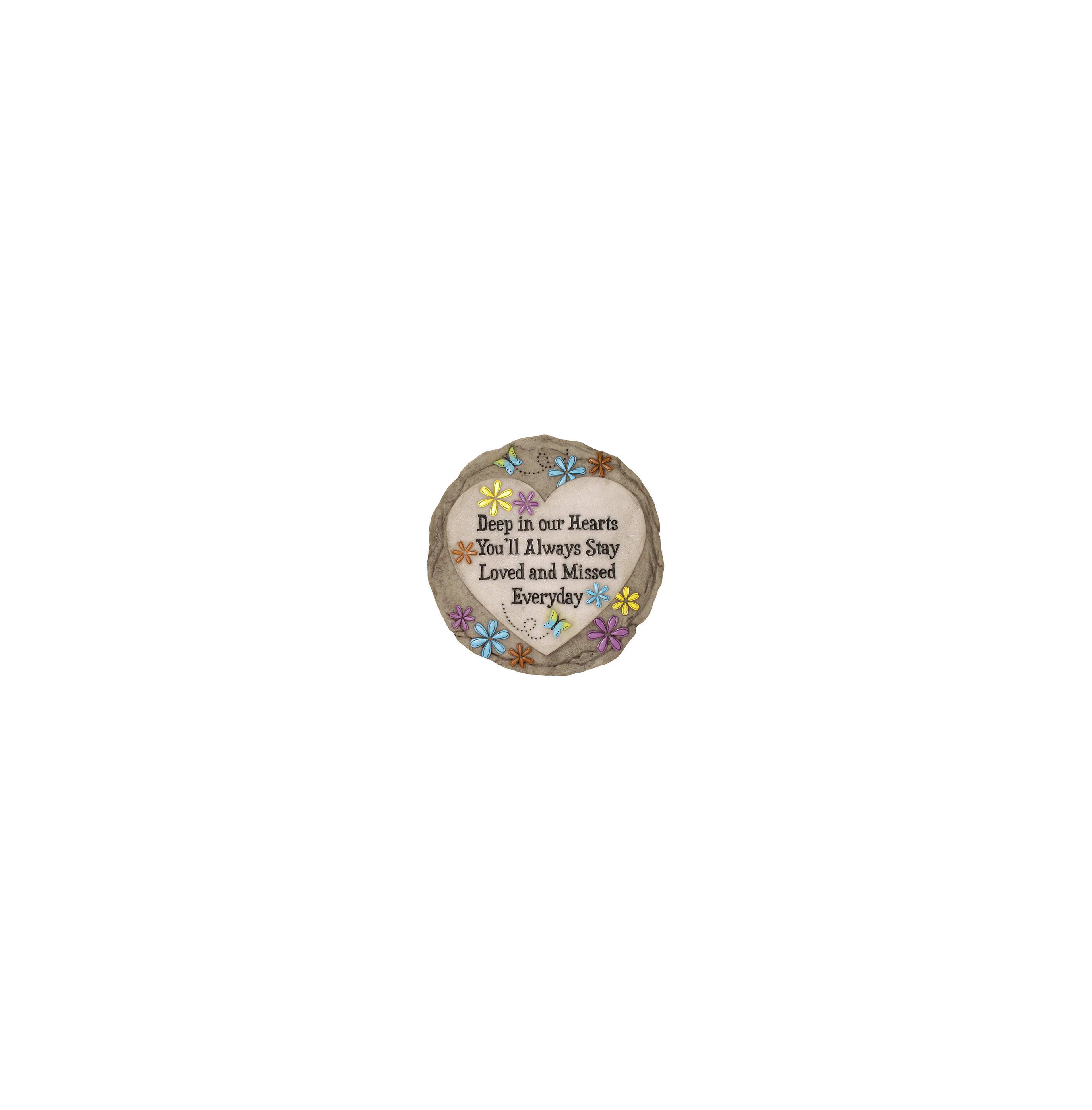 A garden stone adorned with flowers features a message about love and remembrance, placed outdoors.