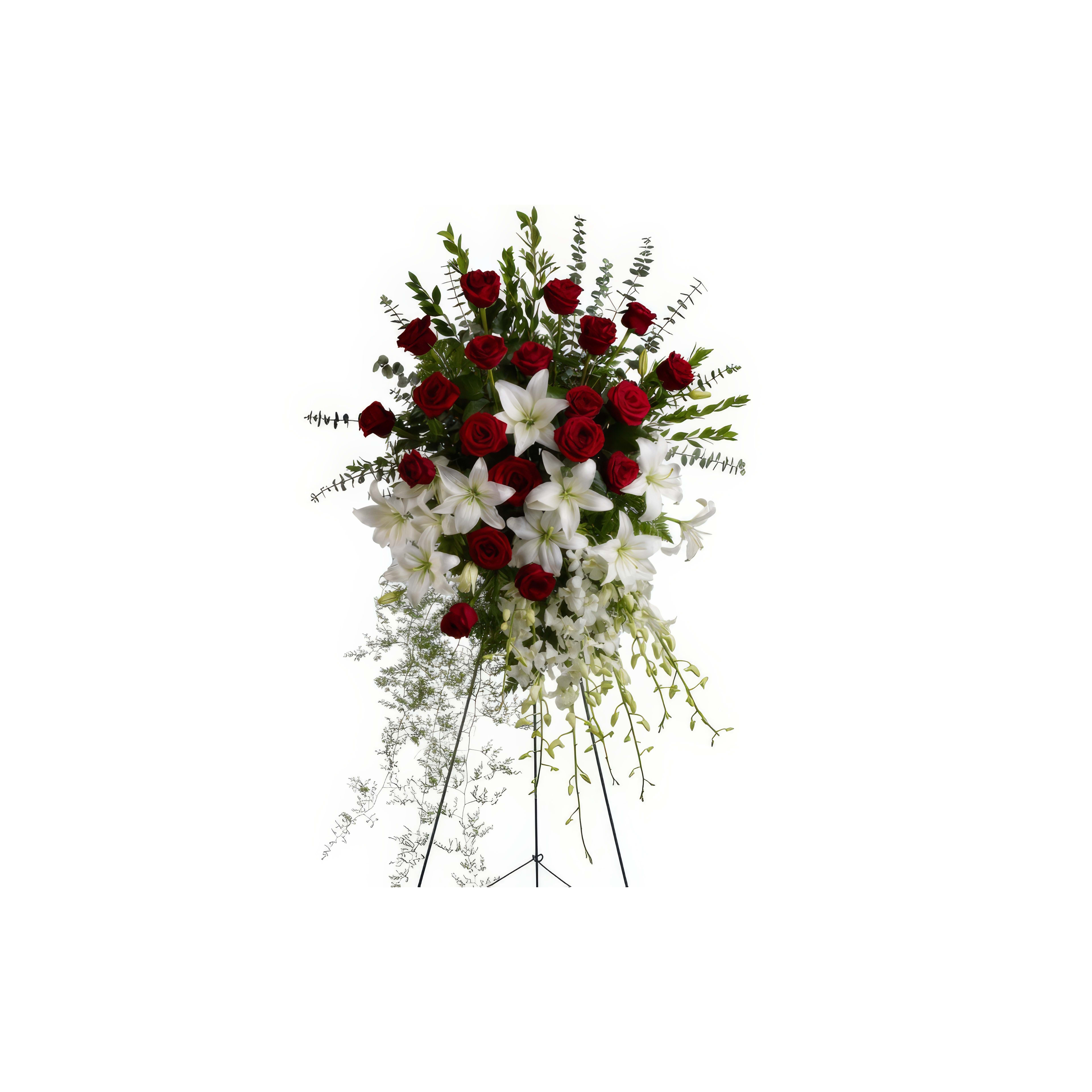 A stunning display of red roses and white lilies adorned with greenery, perfect for celebrations.