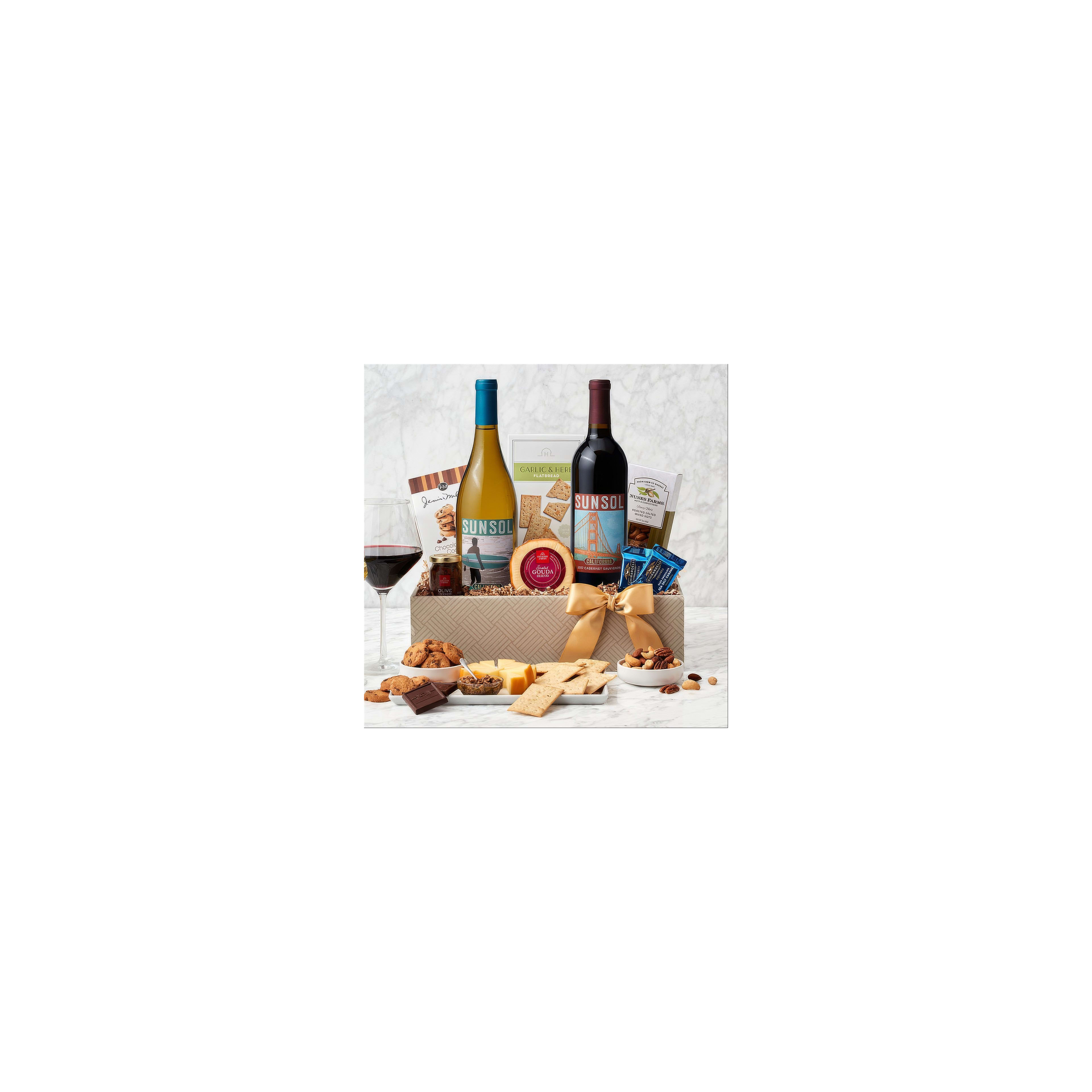 A perfect gift basket showcases two wine bottles, gourmet snacks, and treats ideal for sharing.