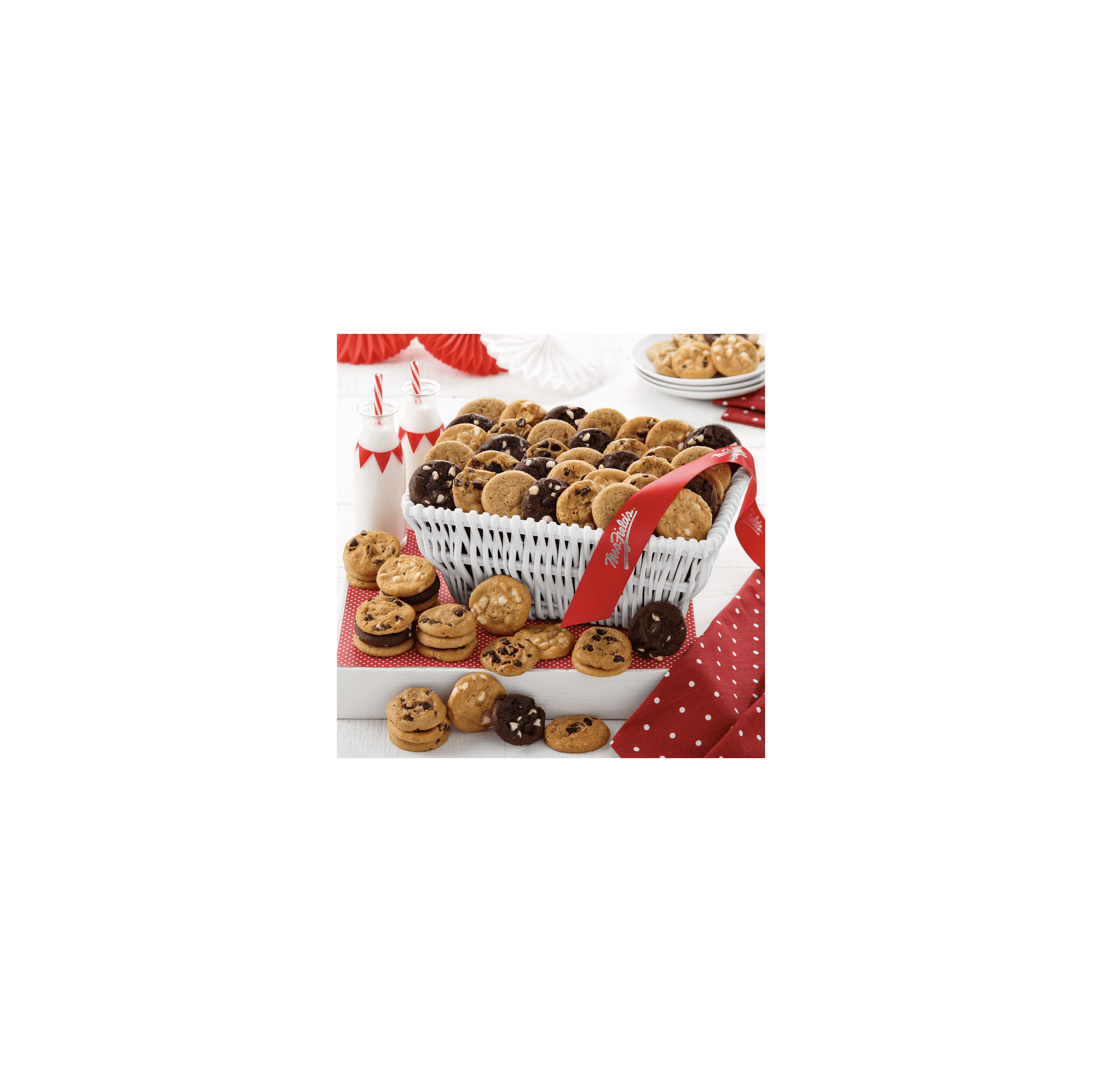 A wicker basket of assorted cookies is on a red-accented table, ready to share.