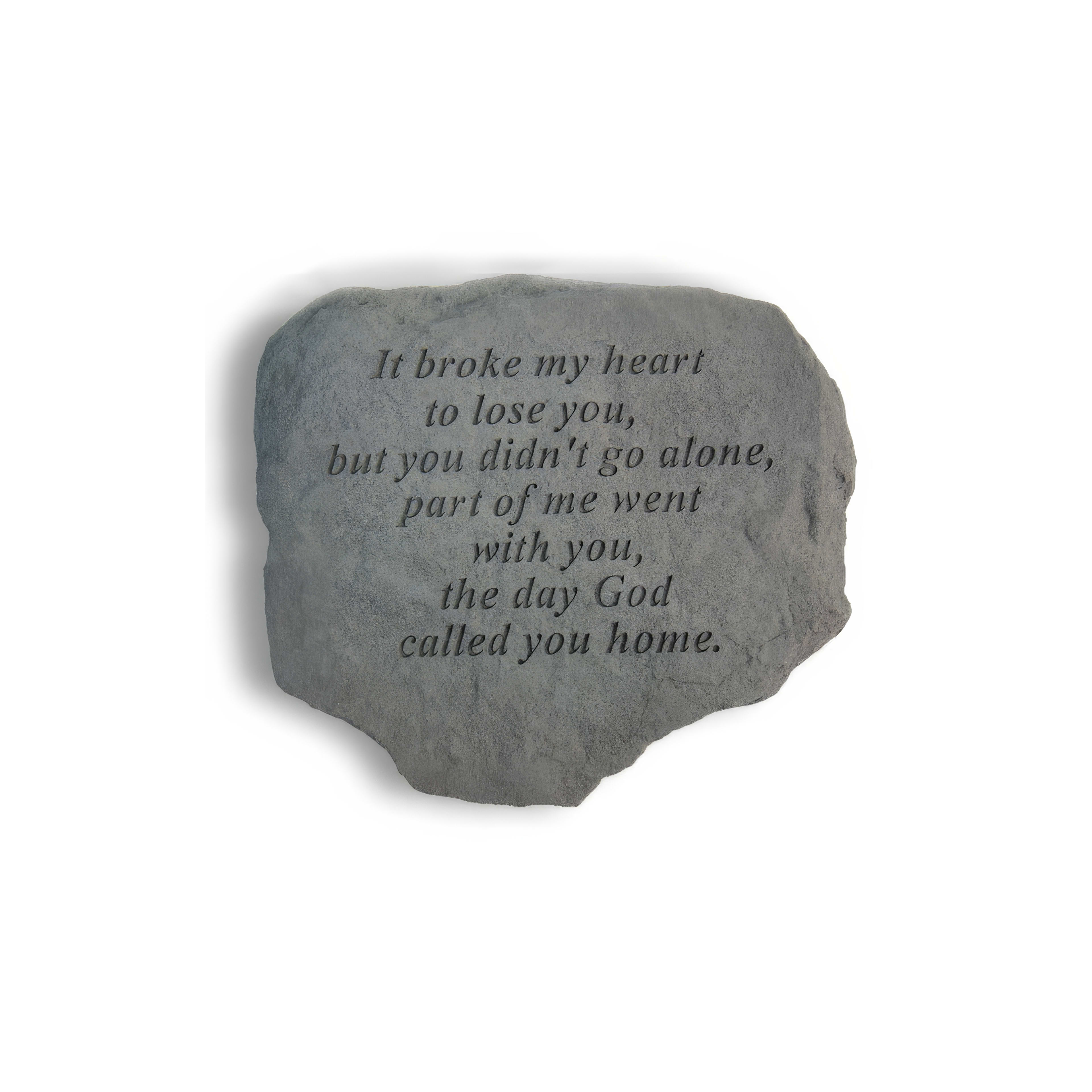 A memorial stone rests quietly, bearing a touching inscription about love and loss.