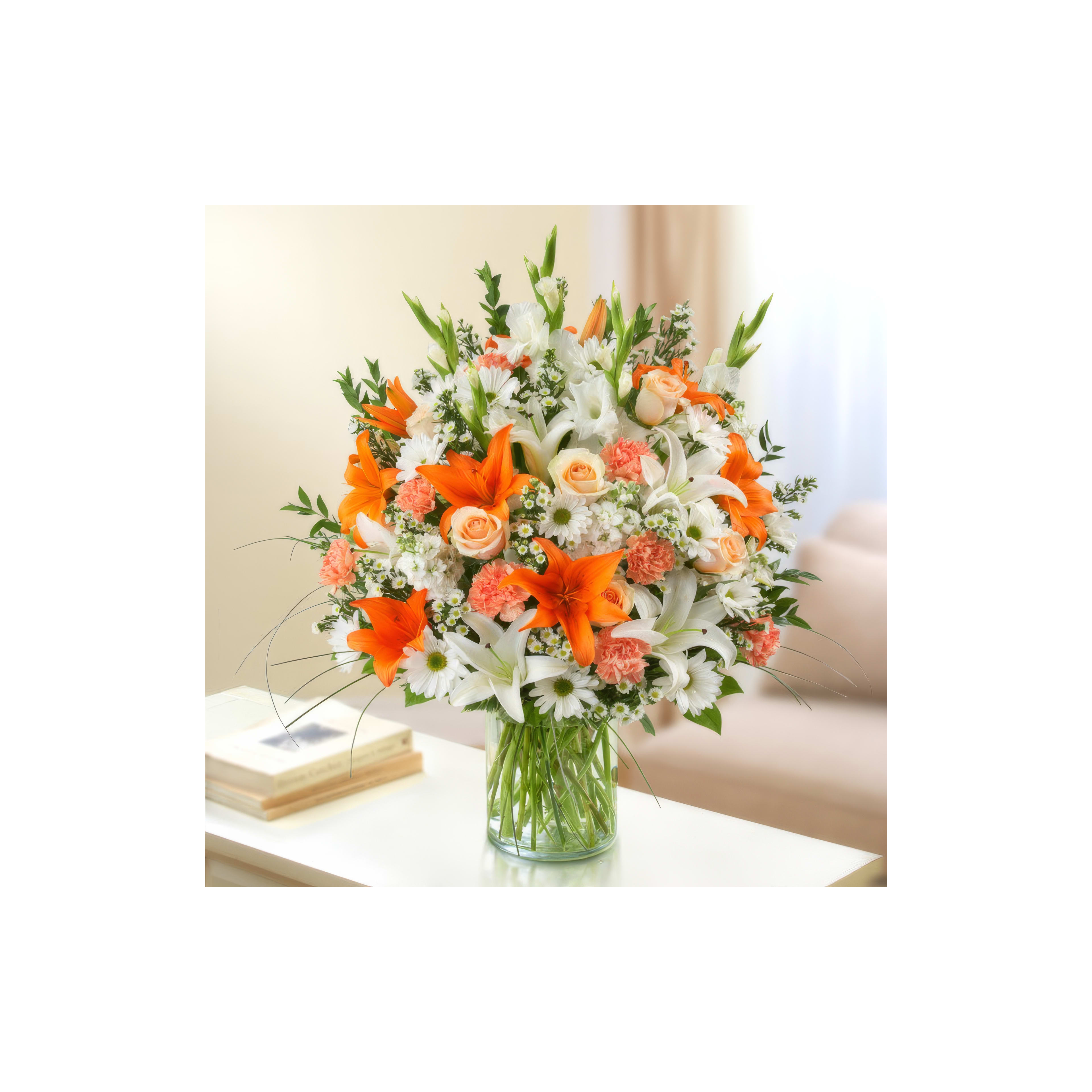 A vibrant bouquet with orange lilies and white blooms brightens a cozy living room space.