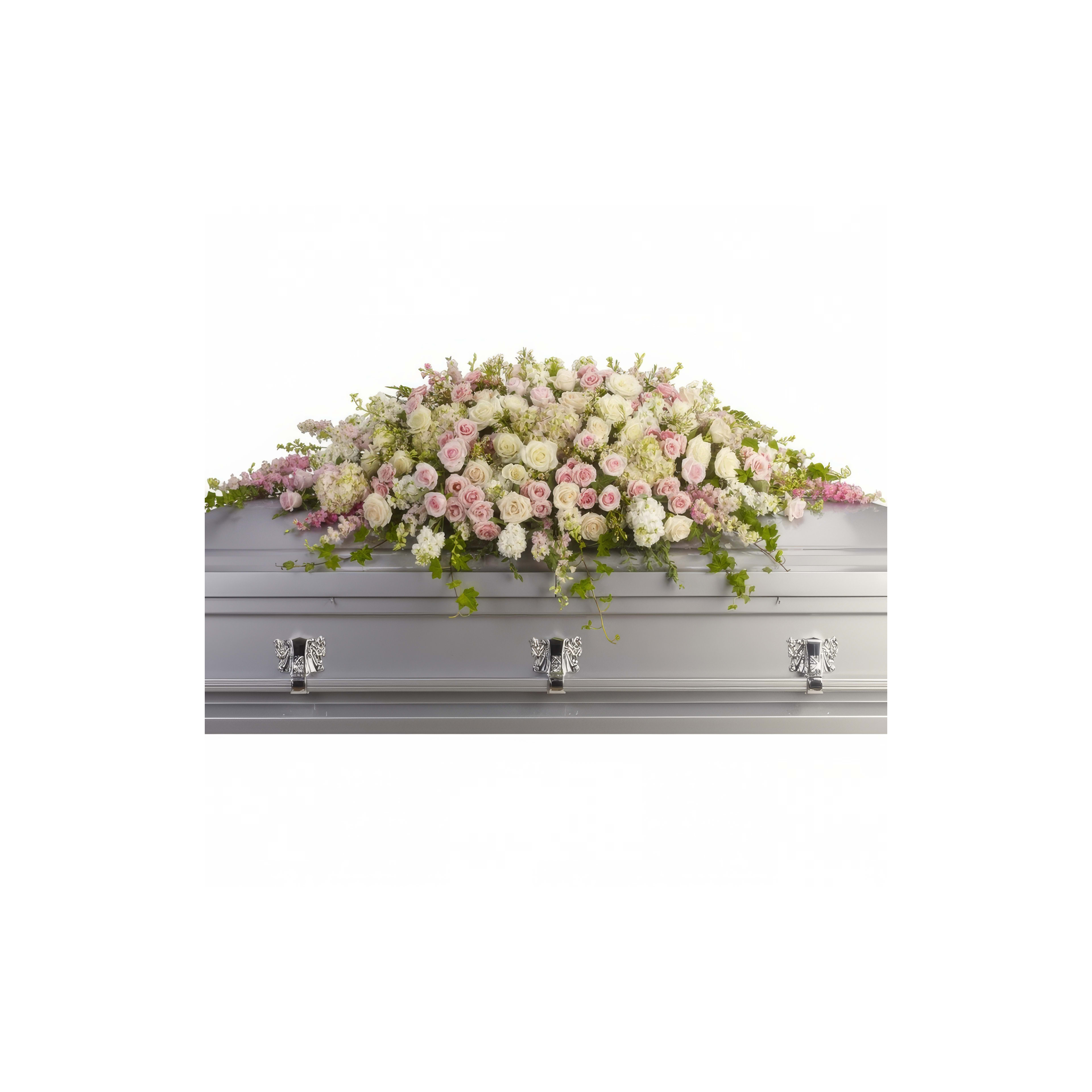 A silver coffin with a floral arrangement at a serene memorial service.