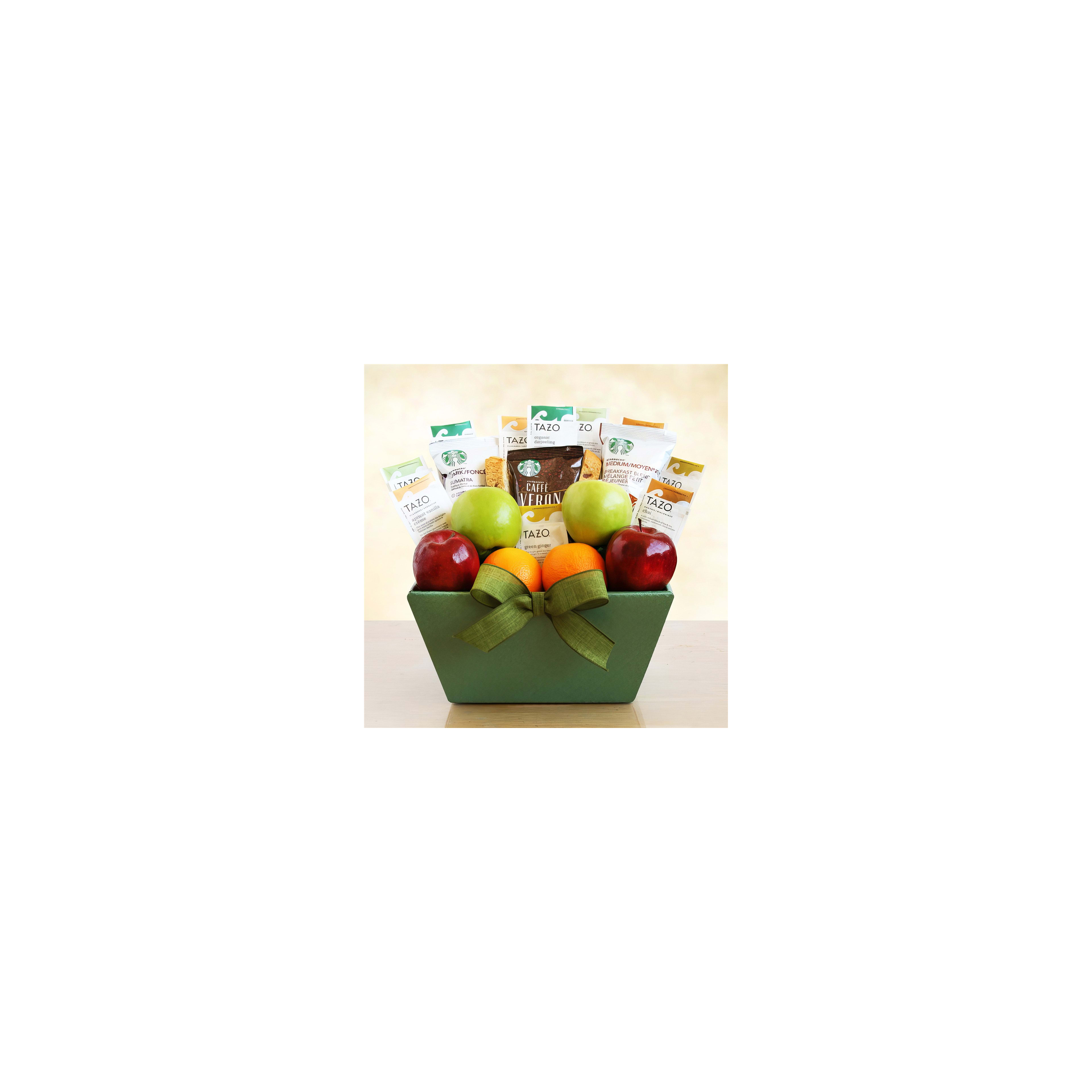 Basket contains green and red apples, oranges, and assorted tea packets for gifting.