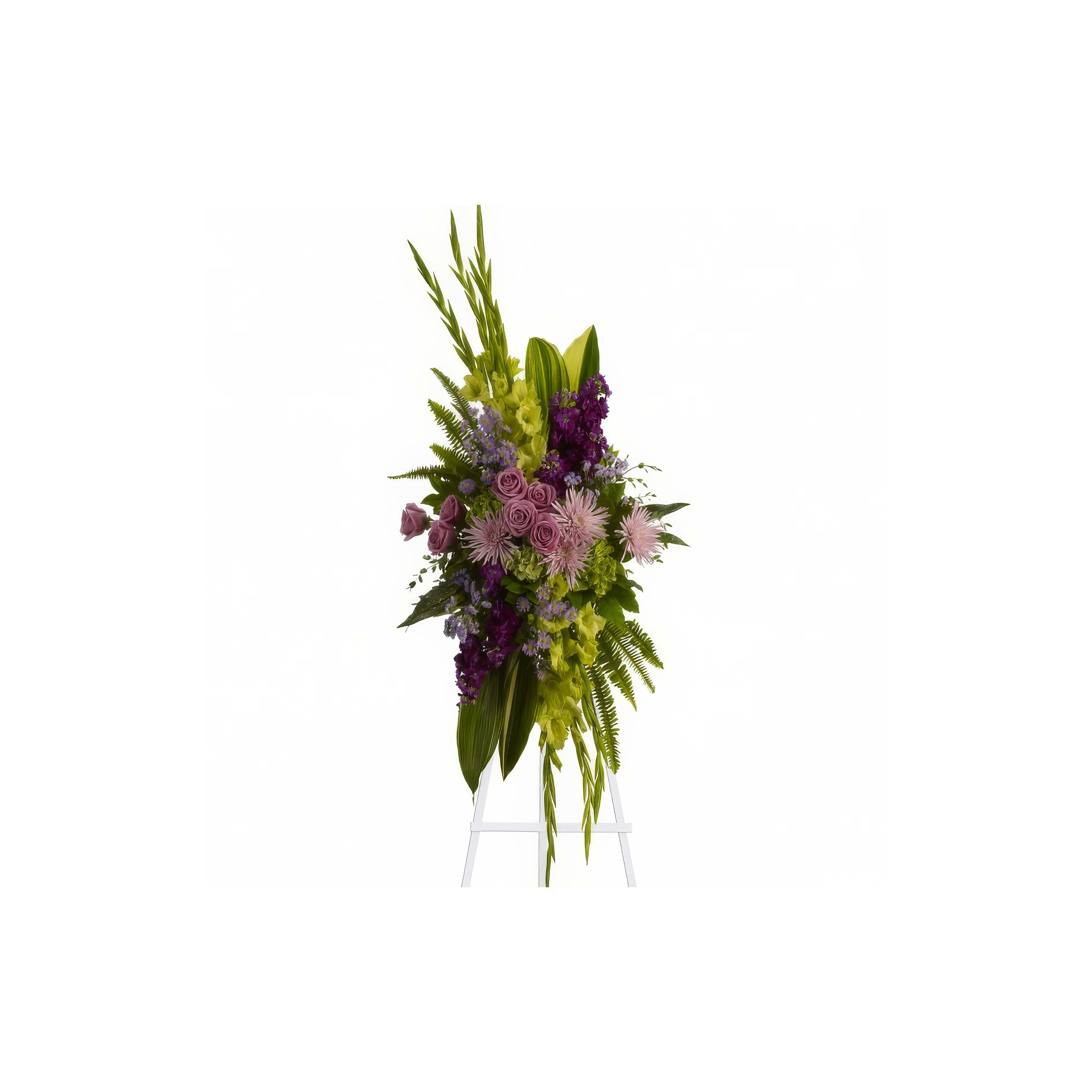 A vibrant floral tribute featuring roses and orchids stands on an easel in a calm atmosphere.