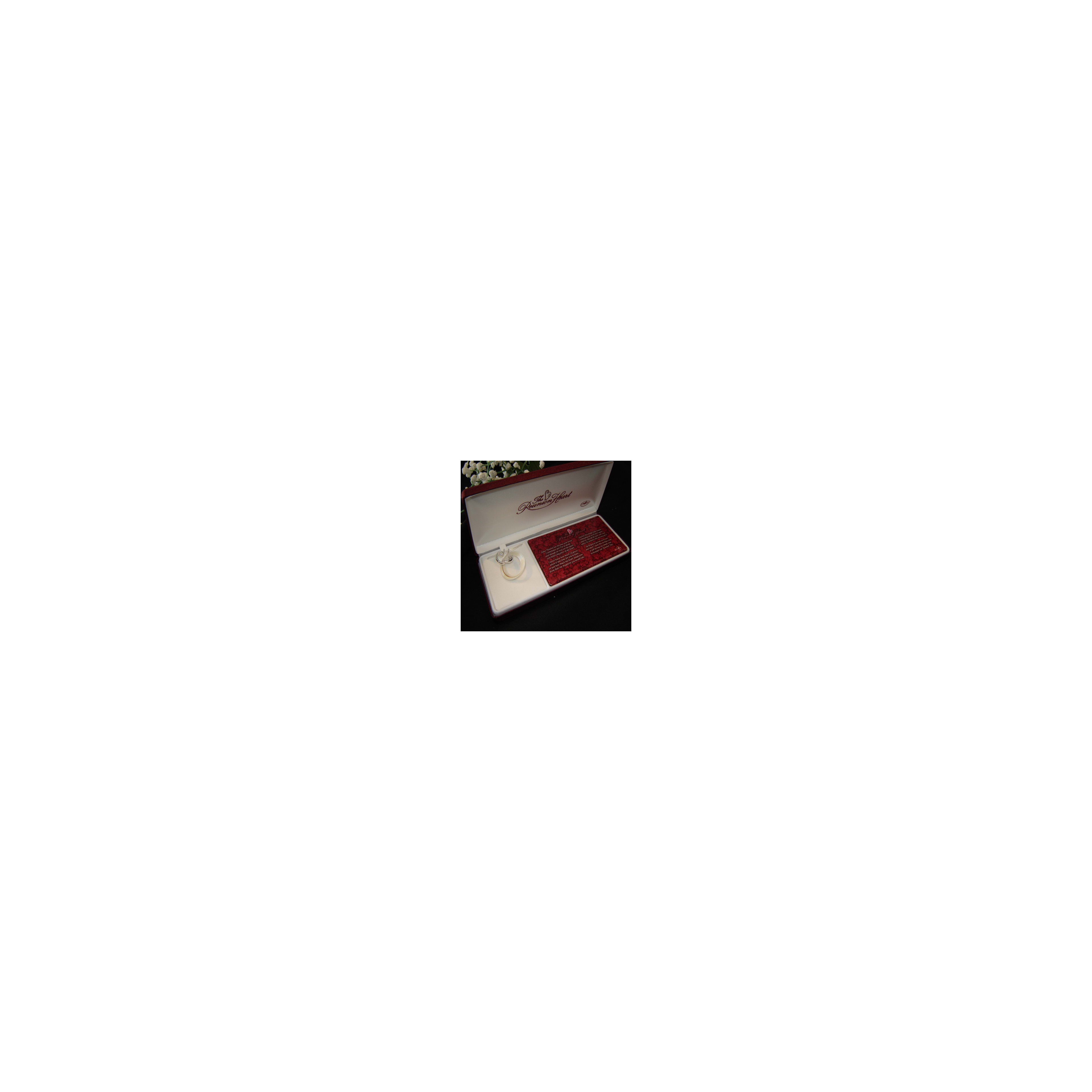 A silver ring lies in a luxurious box featuring a heartfelt message for romantic moments.