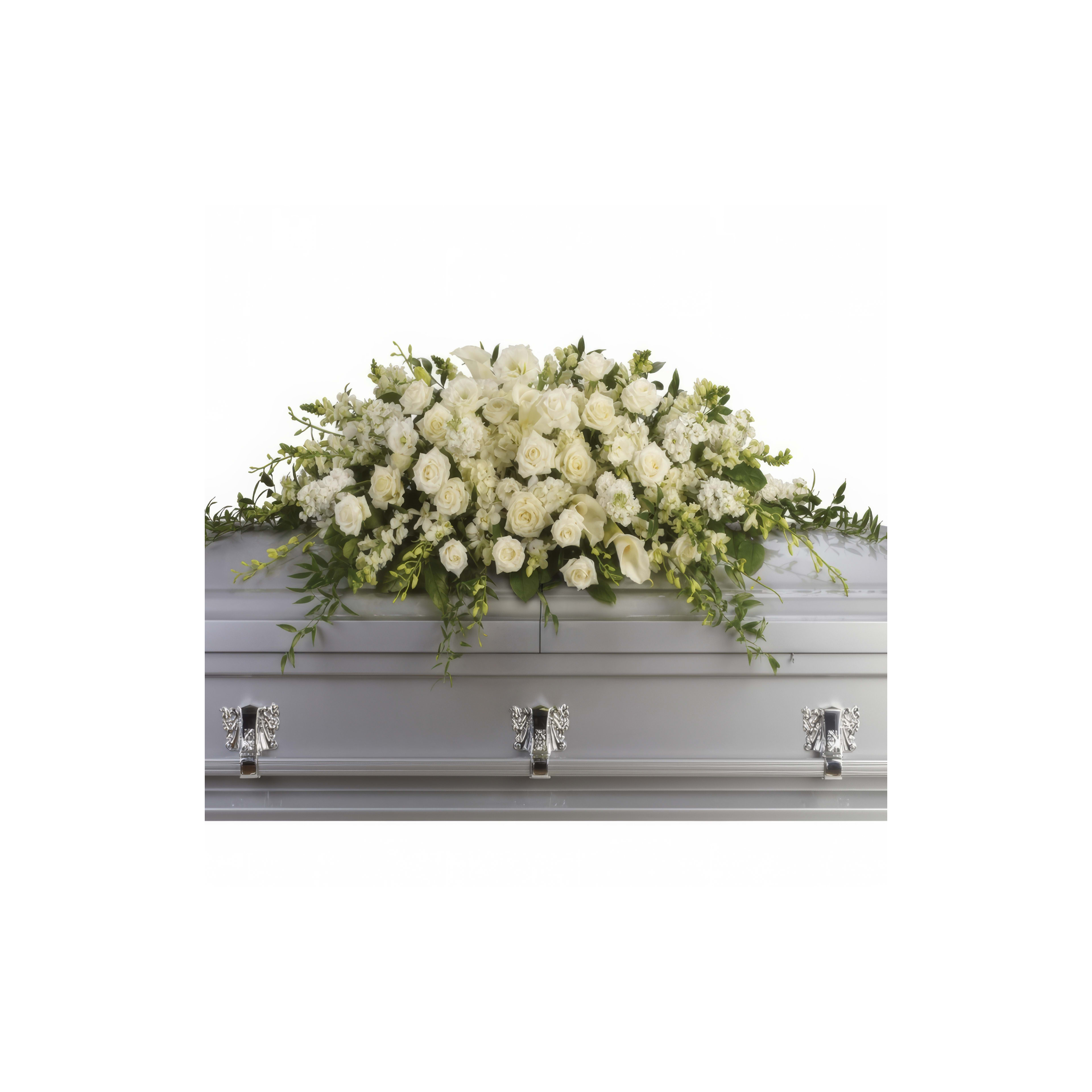 Elegant white floral display atop a silver casket at a solemn memorial gathering.