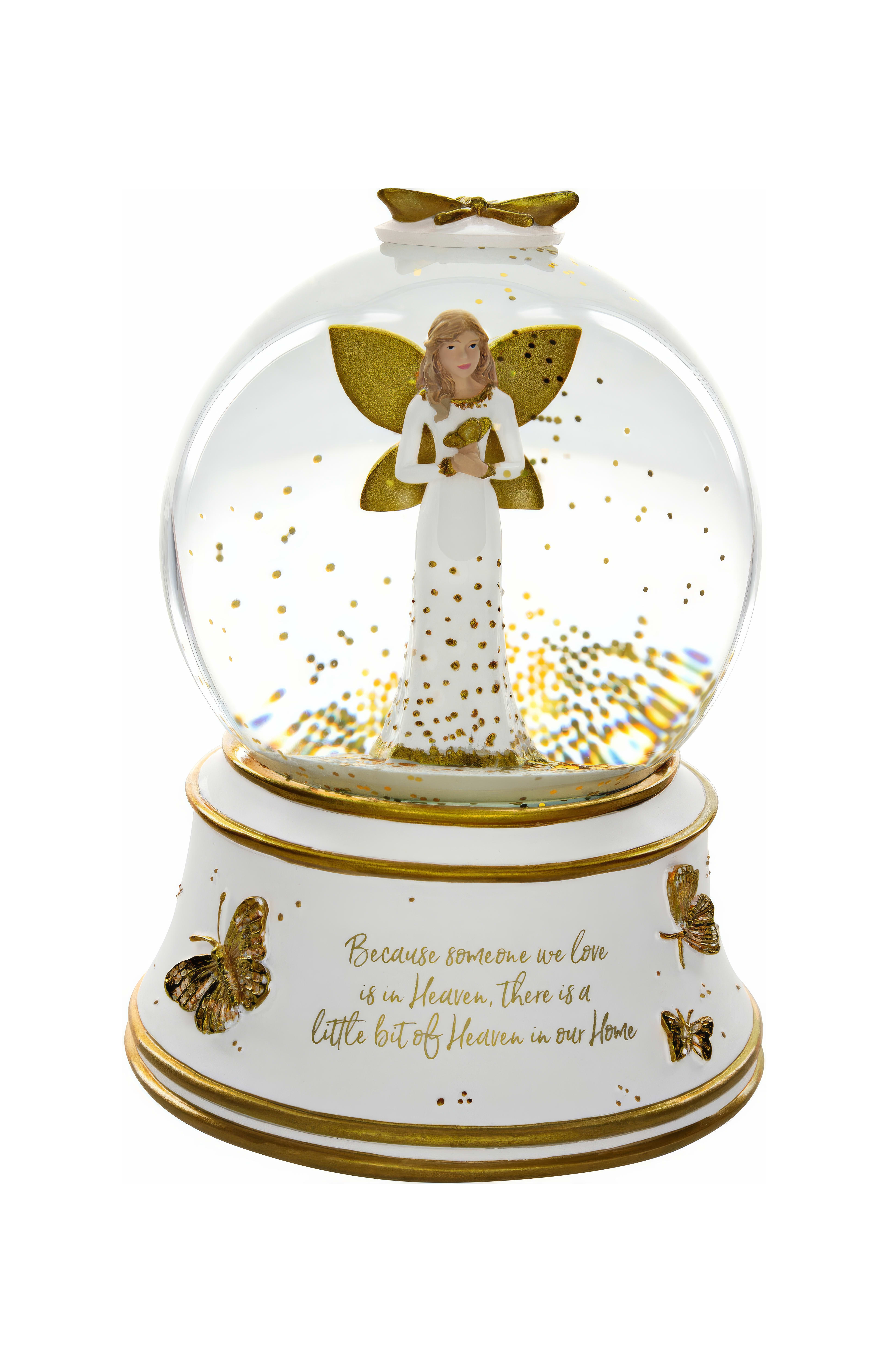 A snow globe features a graceful angel with sparkling butterflies, symbolizing eternal love.