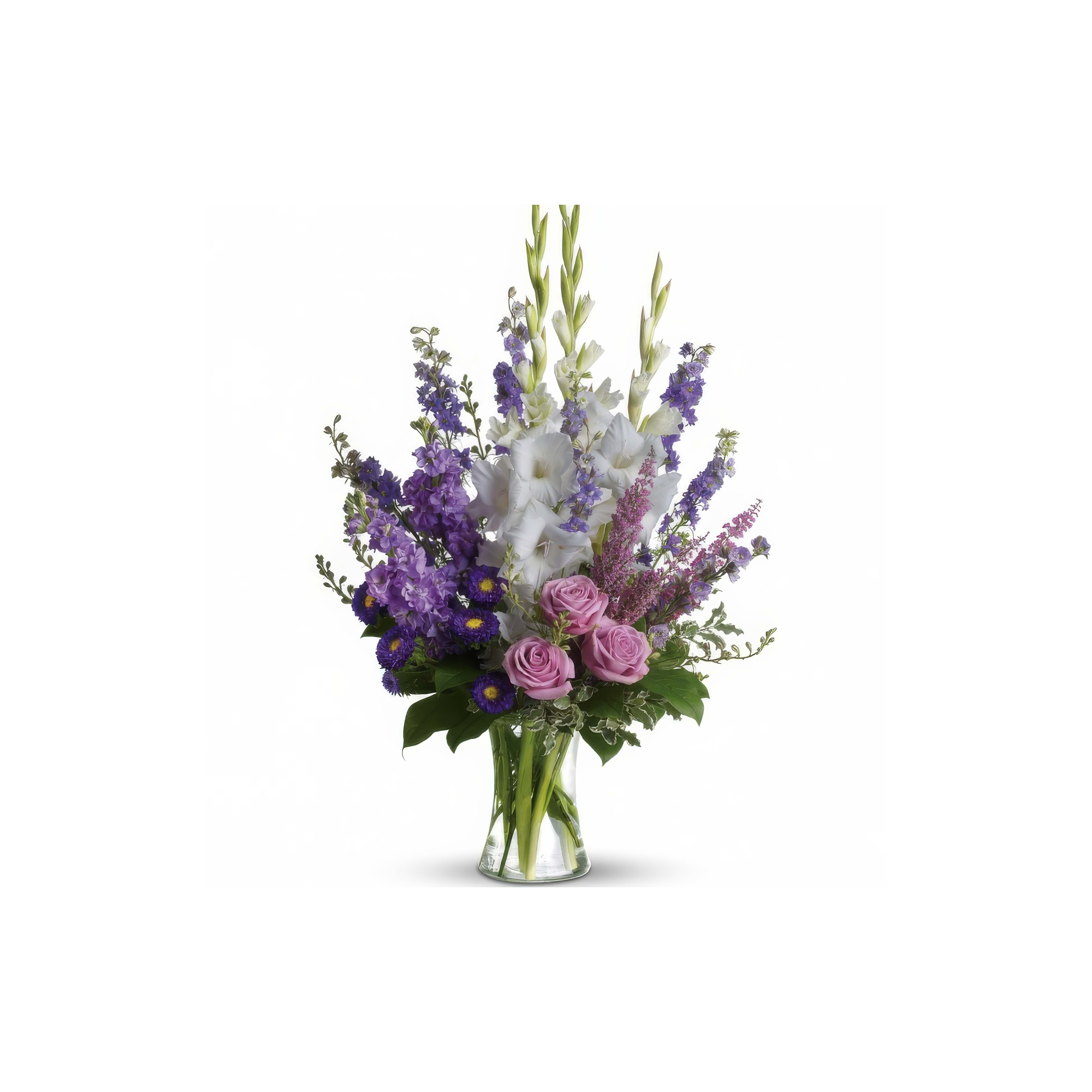 Colorful bouquet showcases purple, pink, and white flowers arranged in an elegant glass vase.