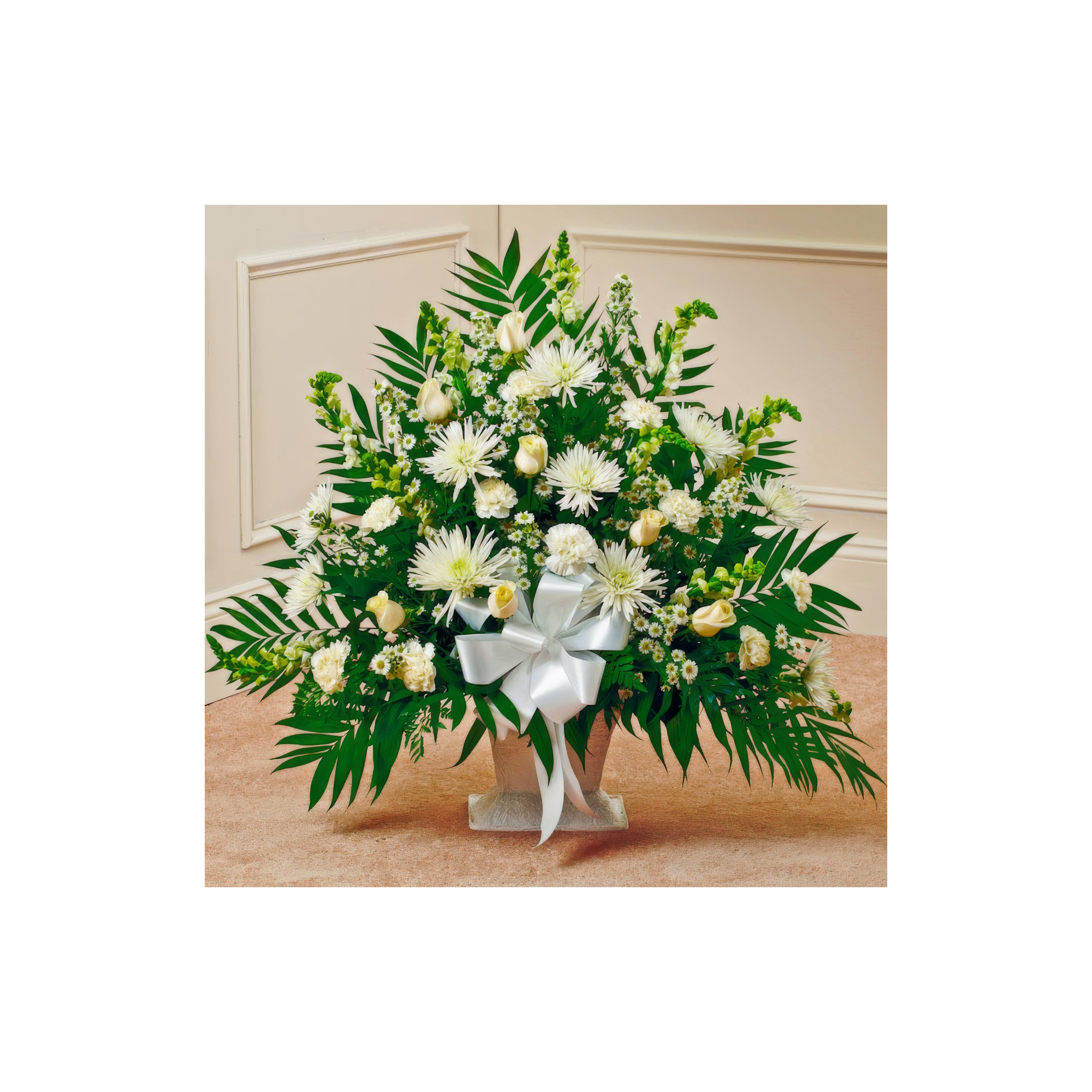 Beautiful white flowers arranged with greenery in a decorative display for an event indoors.