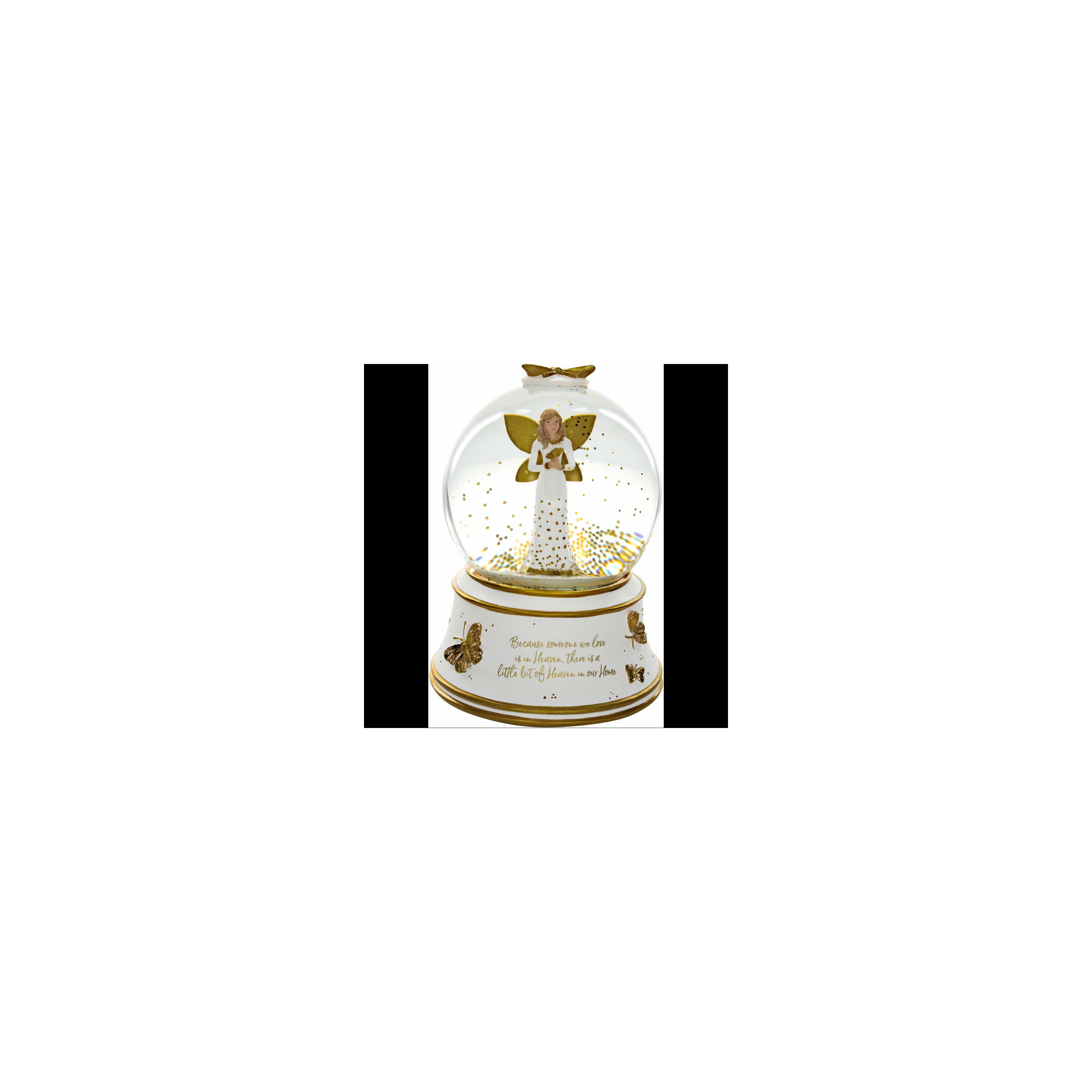 A delicate angel figure inside a snow globe sparkles with golden butterflies and stars.