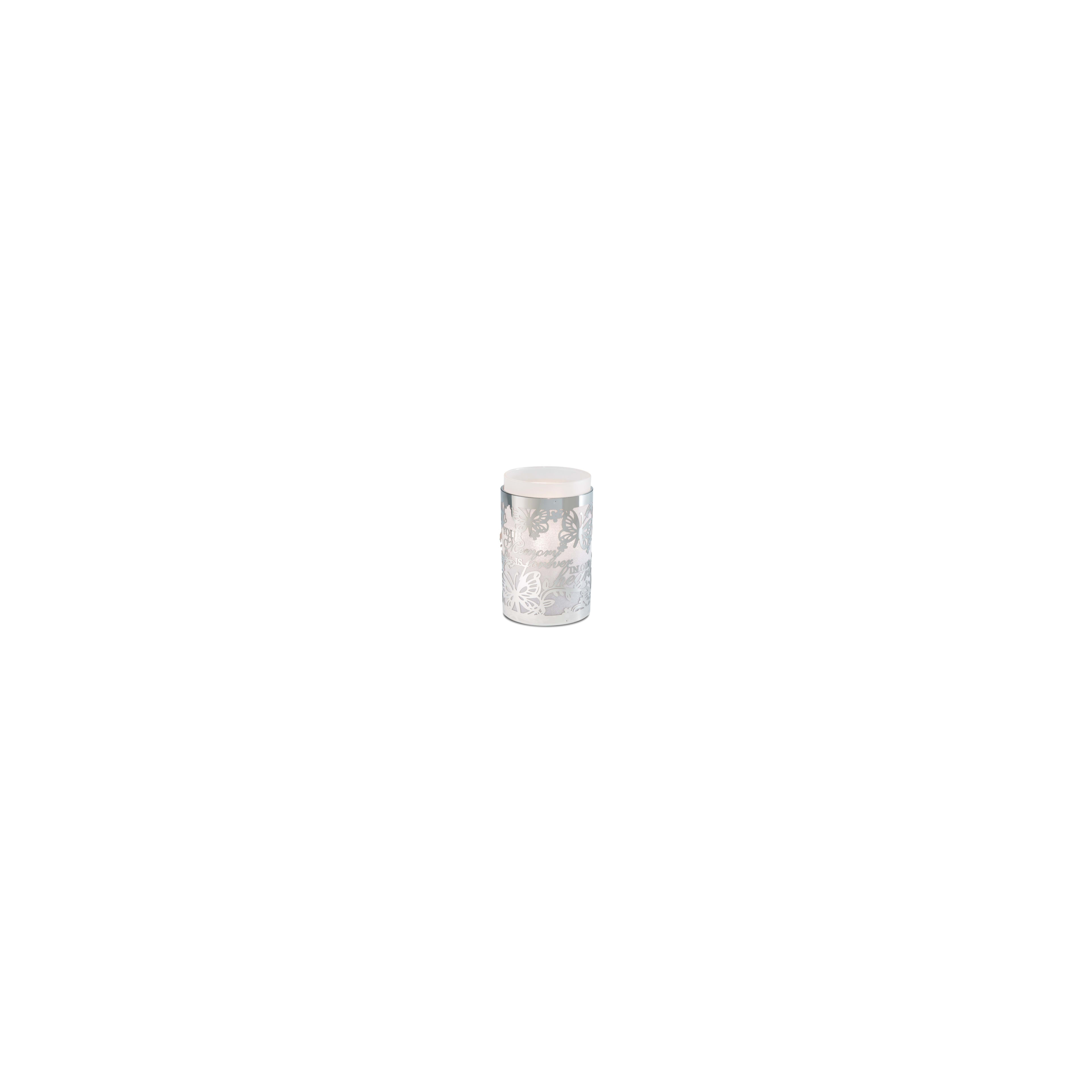 This silver candle holder with intricate butterfly patterns enhances any space.