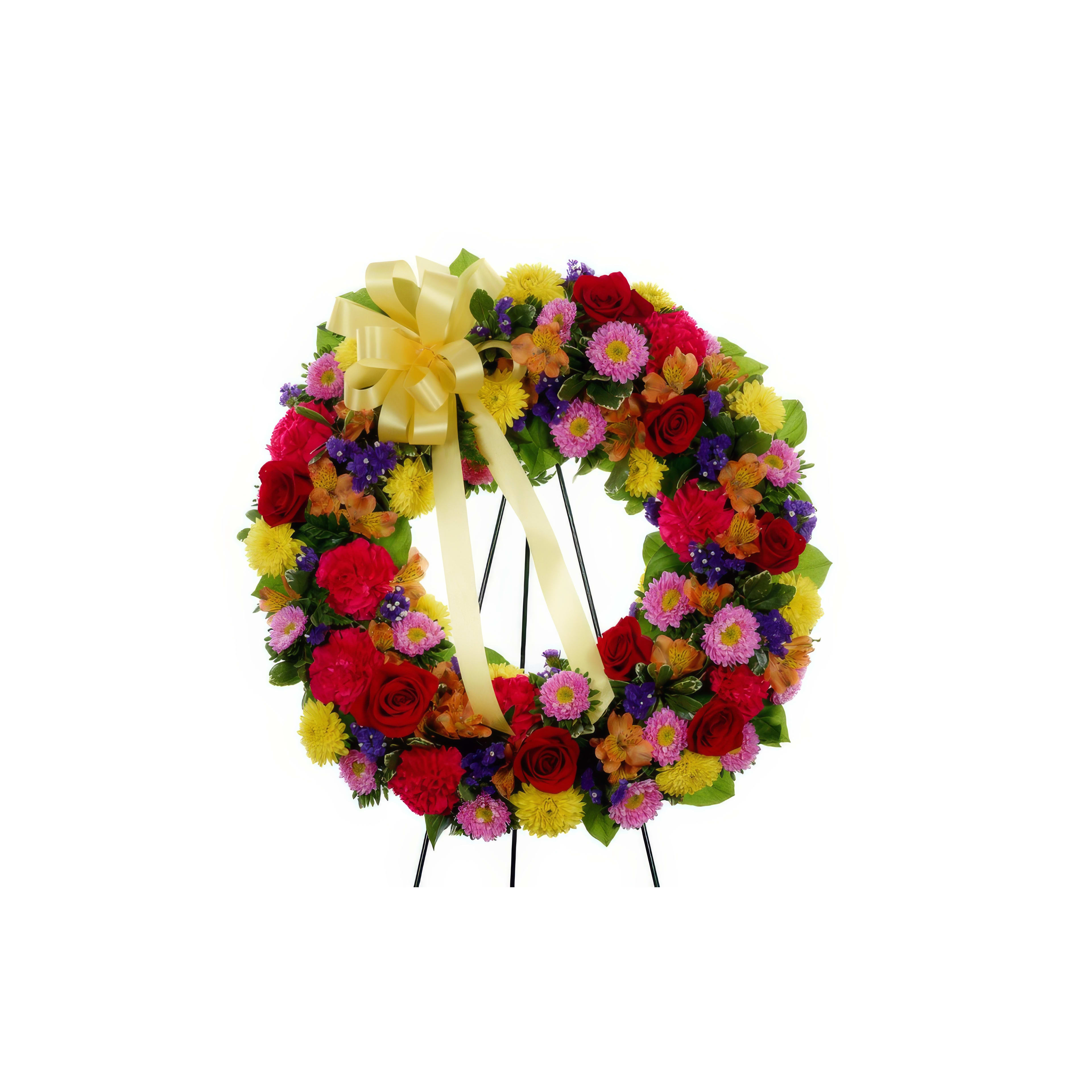 Bright floral arrangement featuring red roses, yellow flowers, and purple blooms on display.