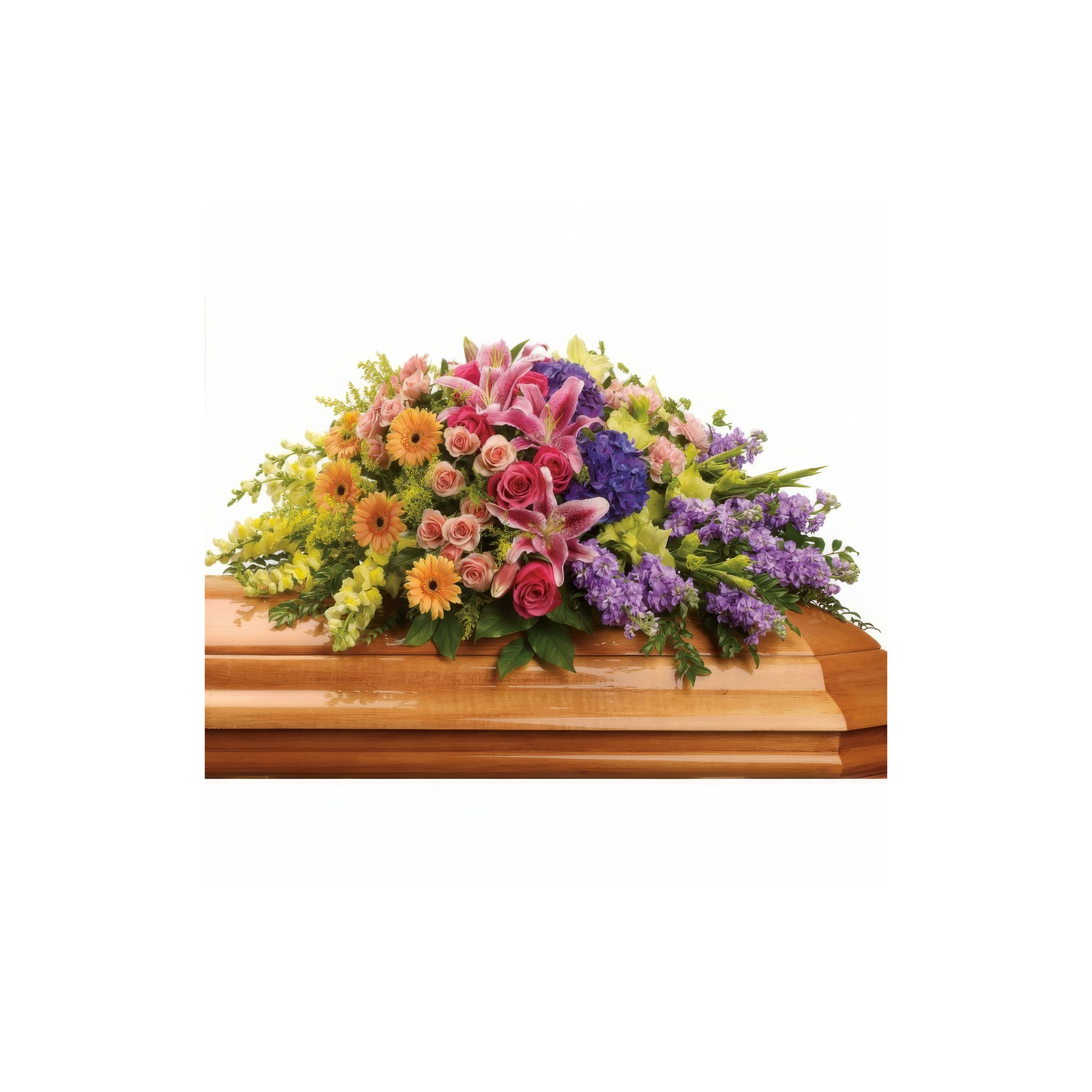 A colorful bouquet on a wooden casket at a memorial service symbolizes love and remembrance.
