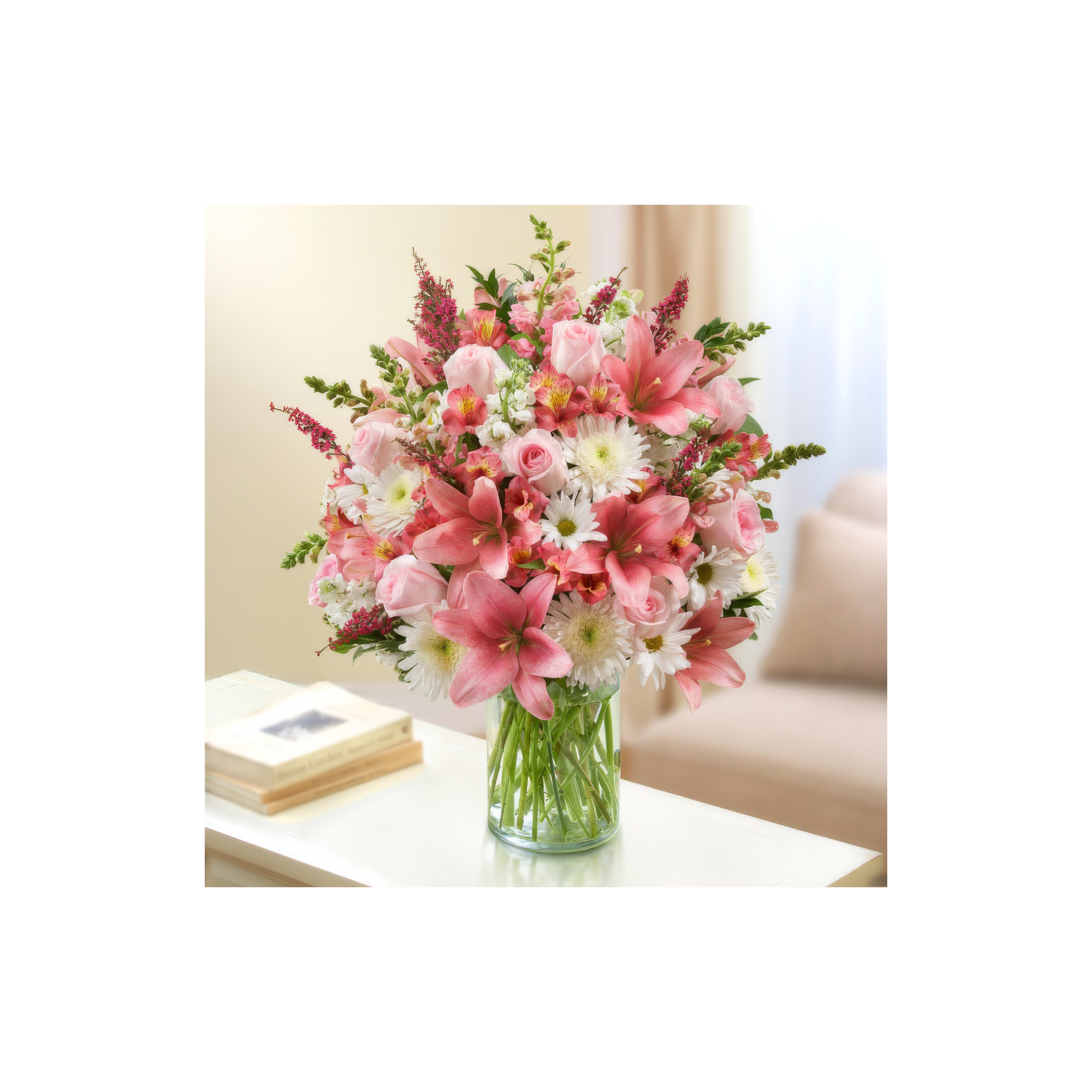 A vibrant bouquet features pink lilies and daisies, brightening the room filled with natural light.