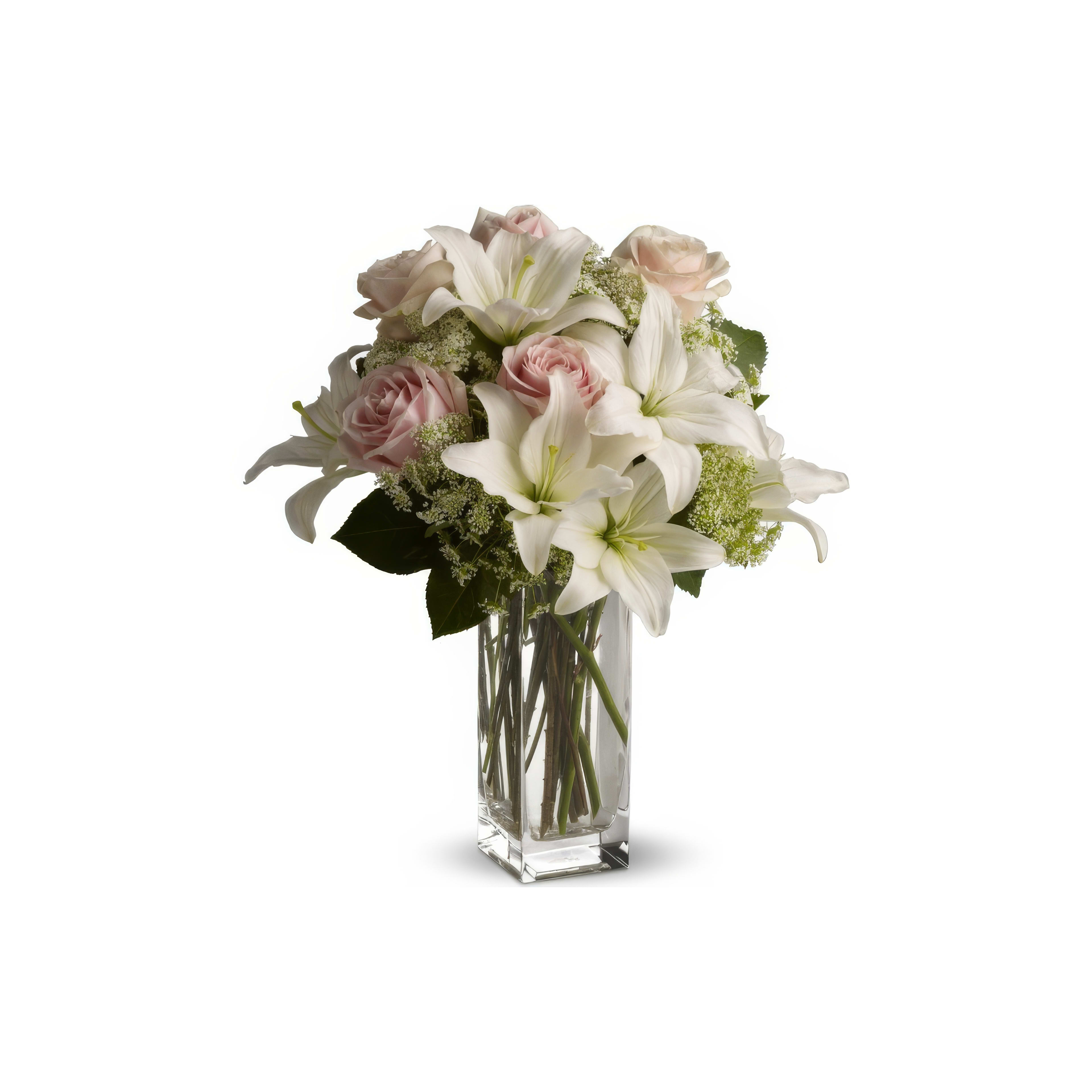 Elegant white lilies and soft pink roses in a glass vase, ideal for any occasion.