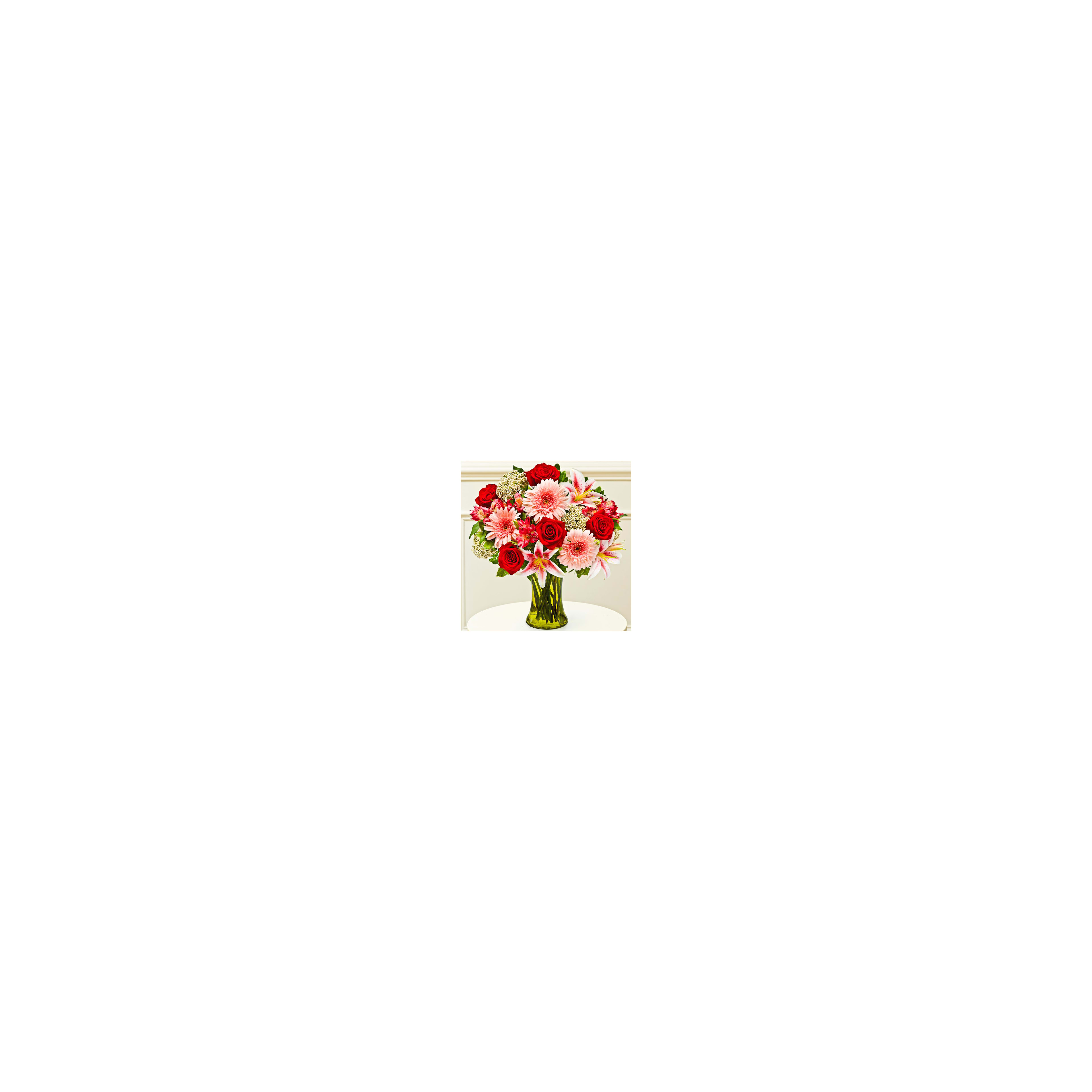 A vibrant bouquet features red roses, pink lilies, and other flowers arranged in a green vase.