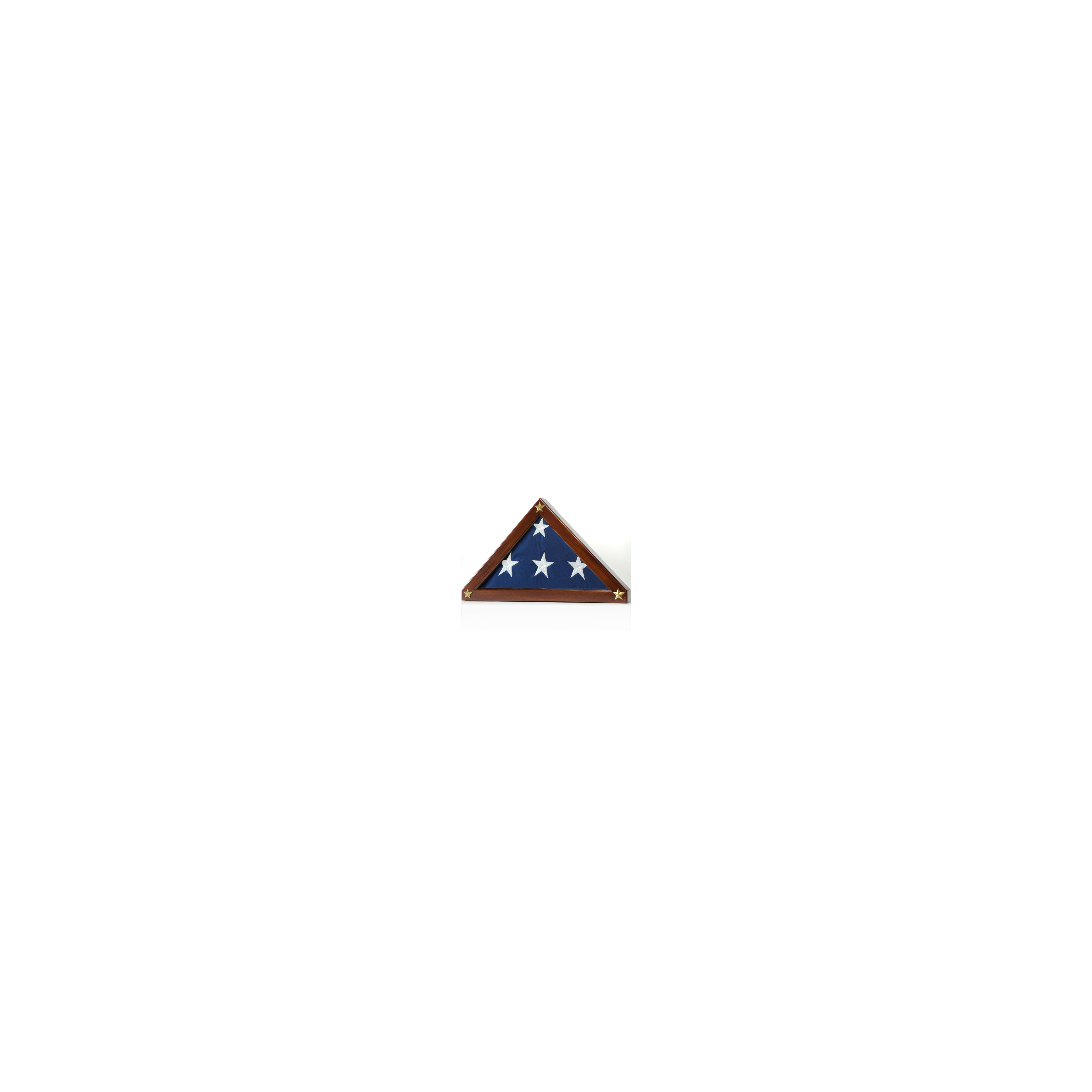 A United States flag is neatly folded and displayed in a triangular wooden case adorned with stars.