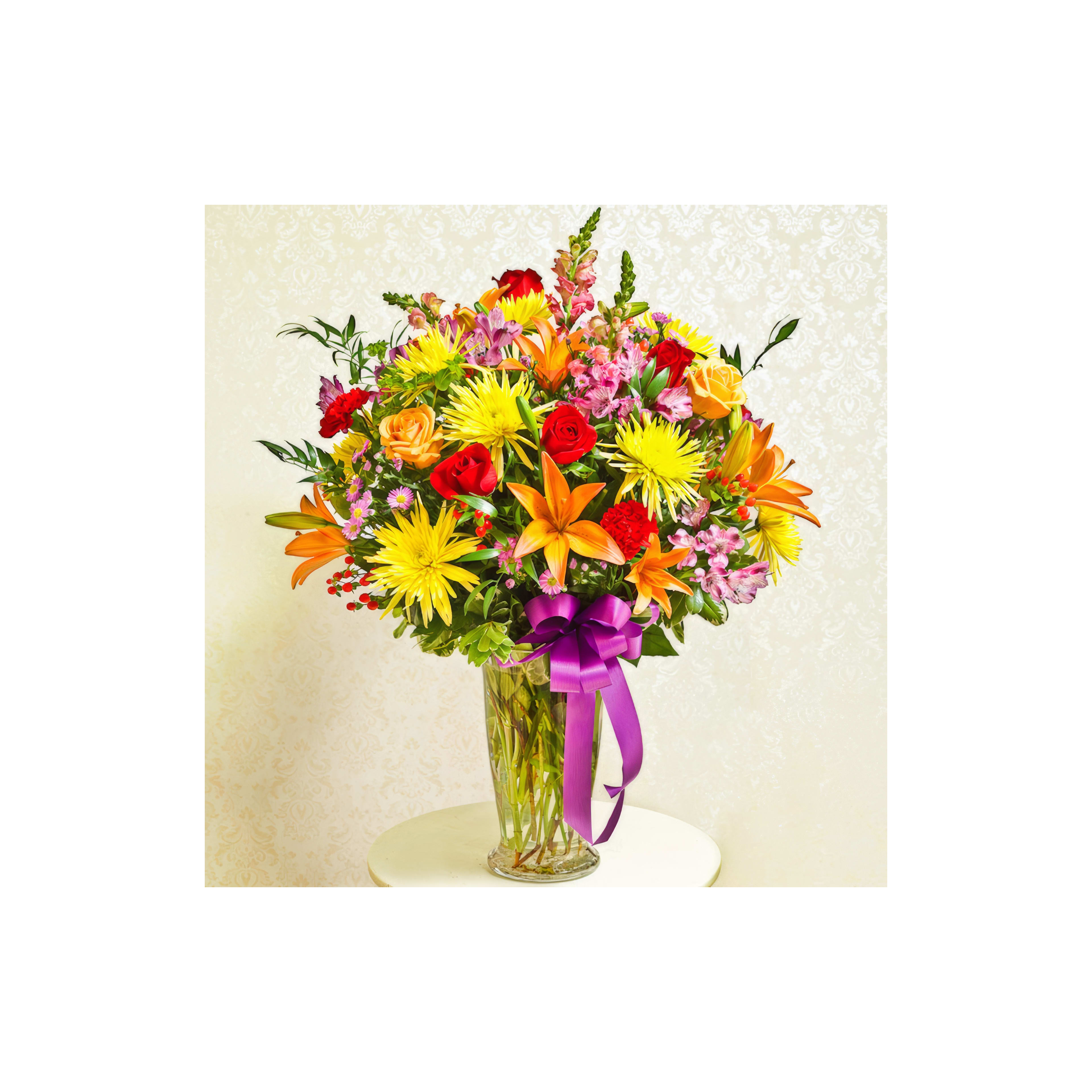 A vibrant bouquet of mixed flowers including roses and lilies displayed elegantly on a table.