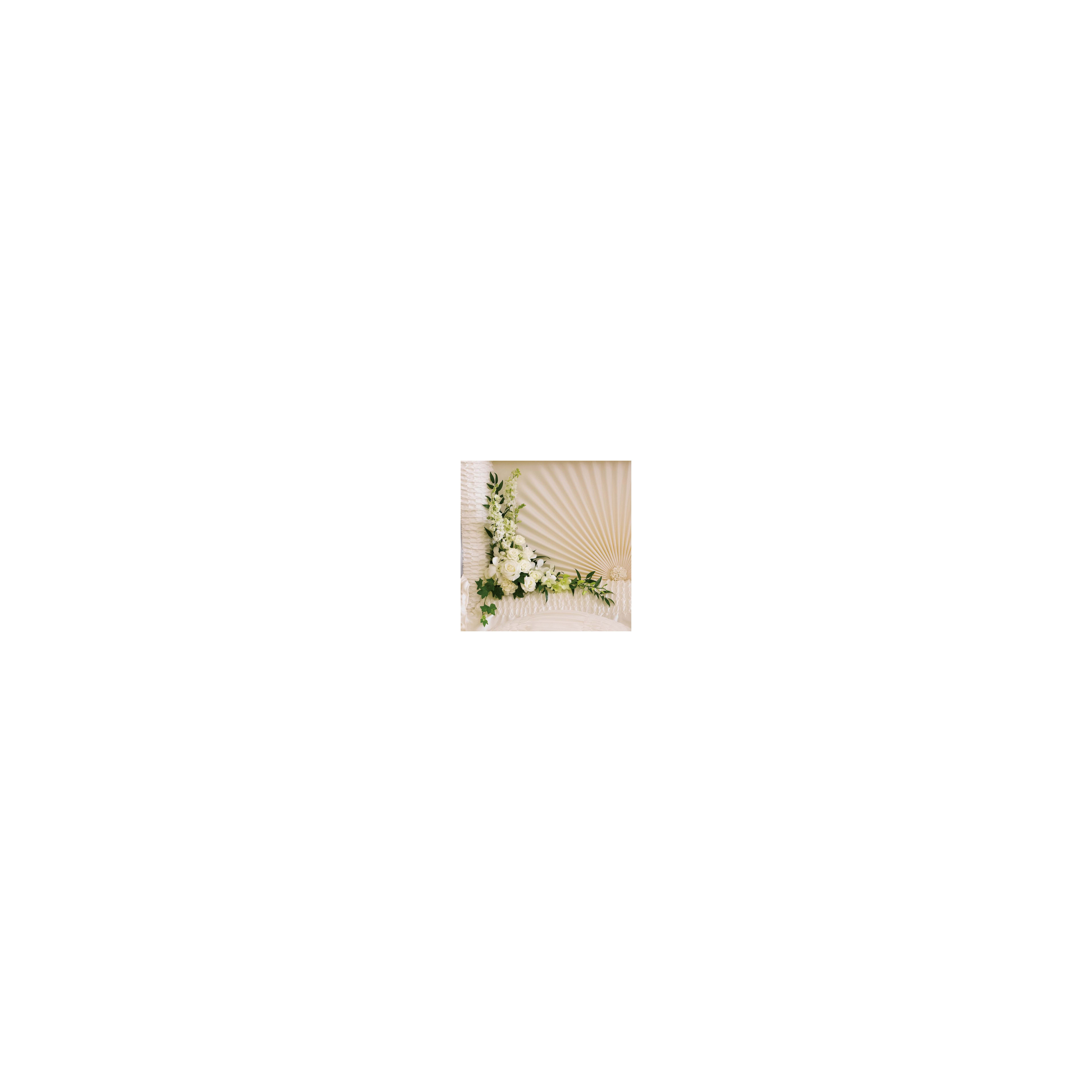 A delicate white flower arrangement against a textured wall enhances the bright atmosphere.