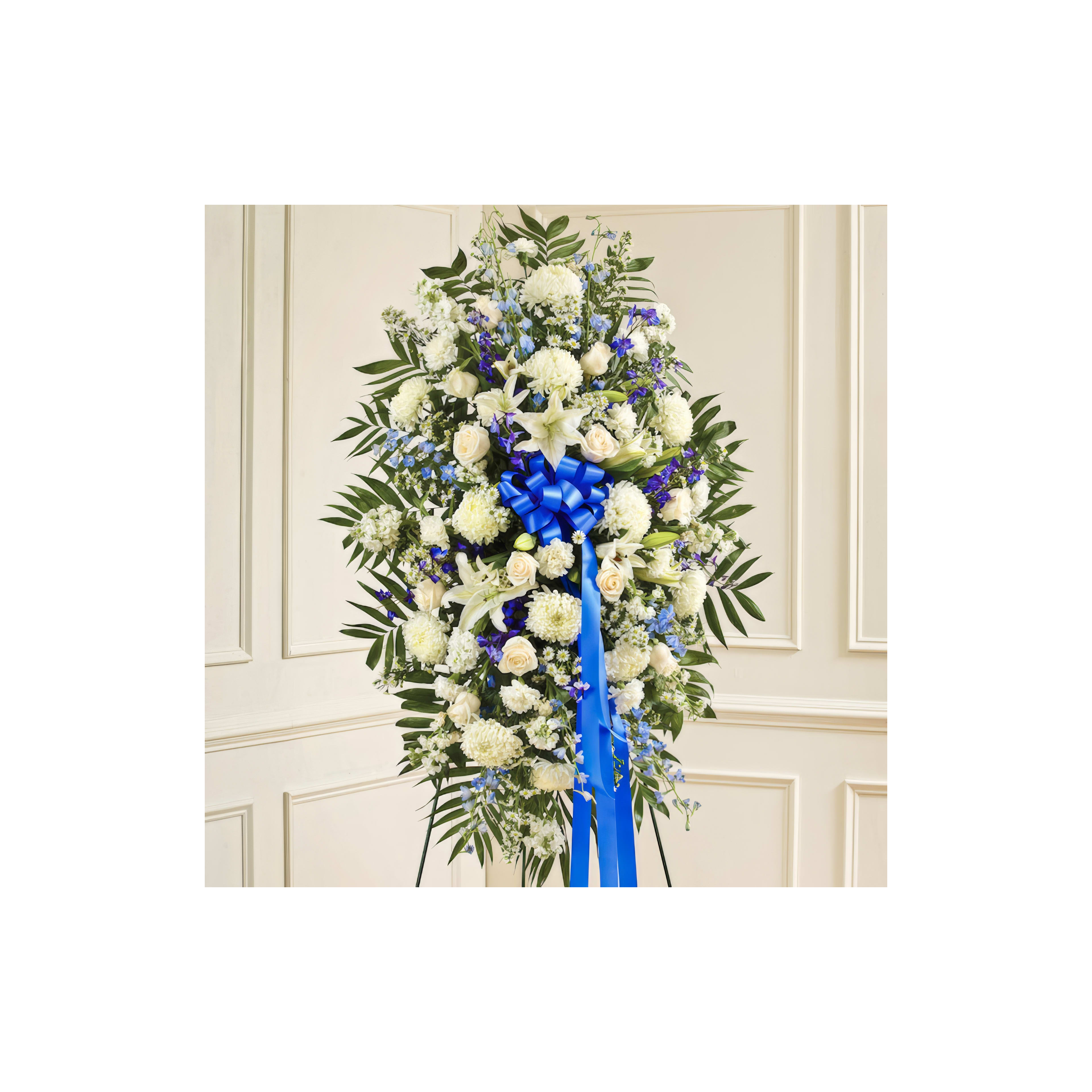 Elegant display of white and blue flowers arranged with lush greenery for a ceremony.
