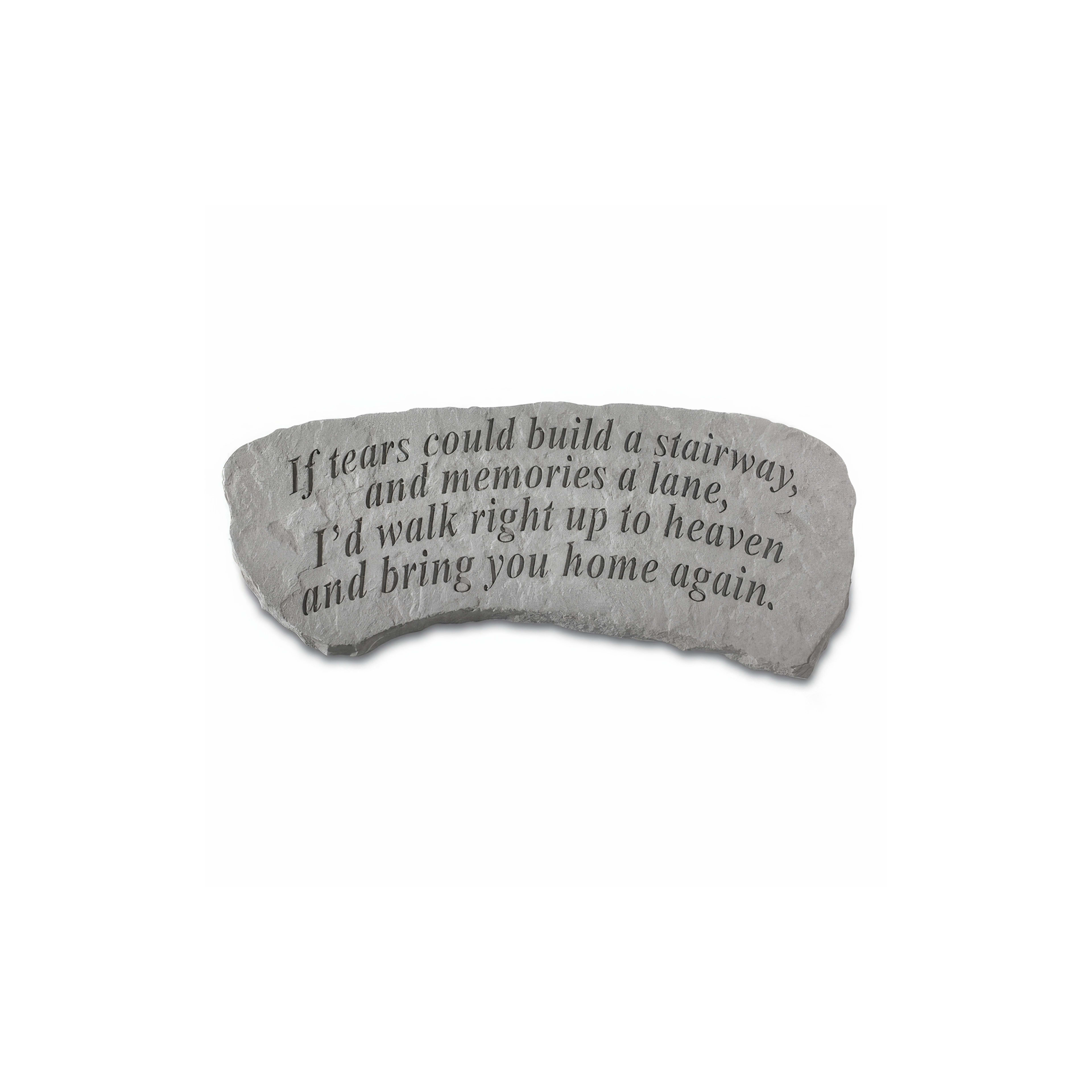 A stone engraved with an emotional message about love and loss, inviting reflection on memories.