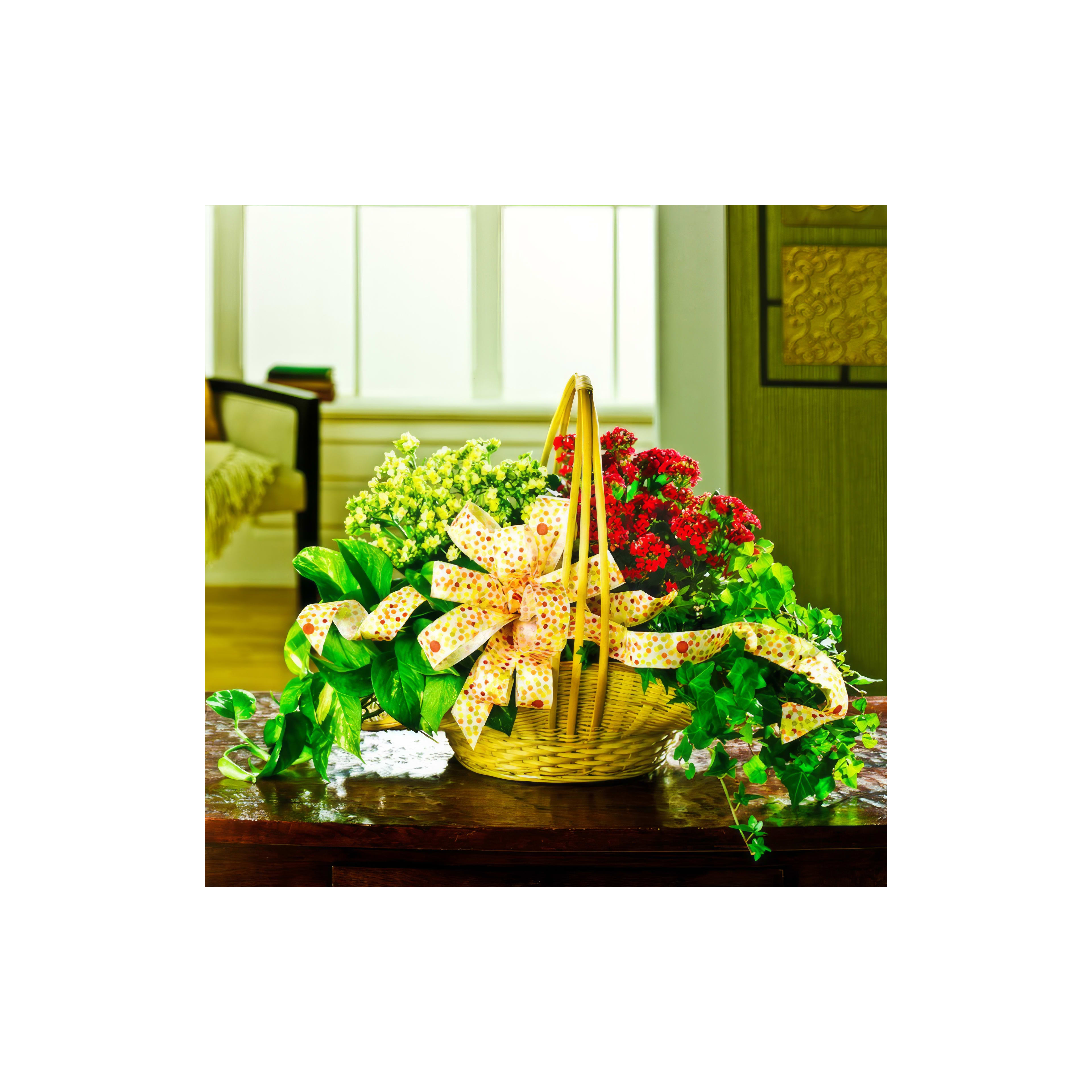 A vibrant floral display featuring red and yellow flowers in a basket on a wooden table.
