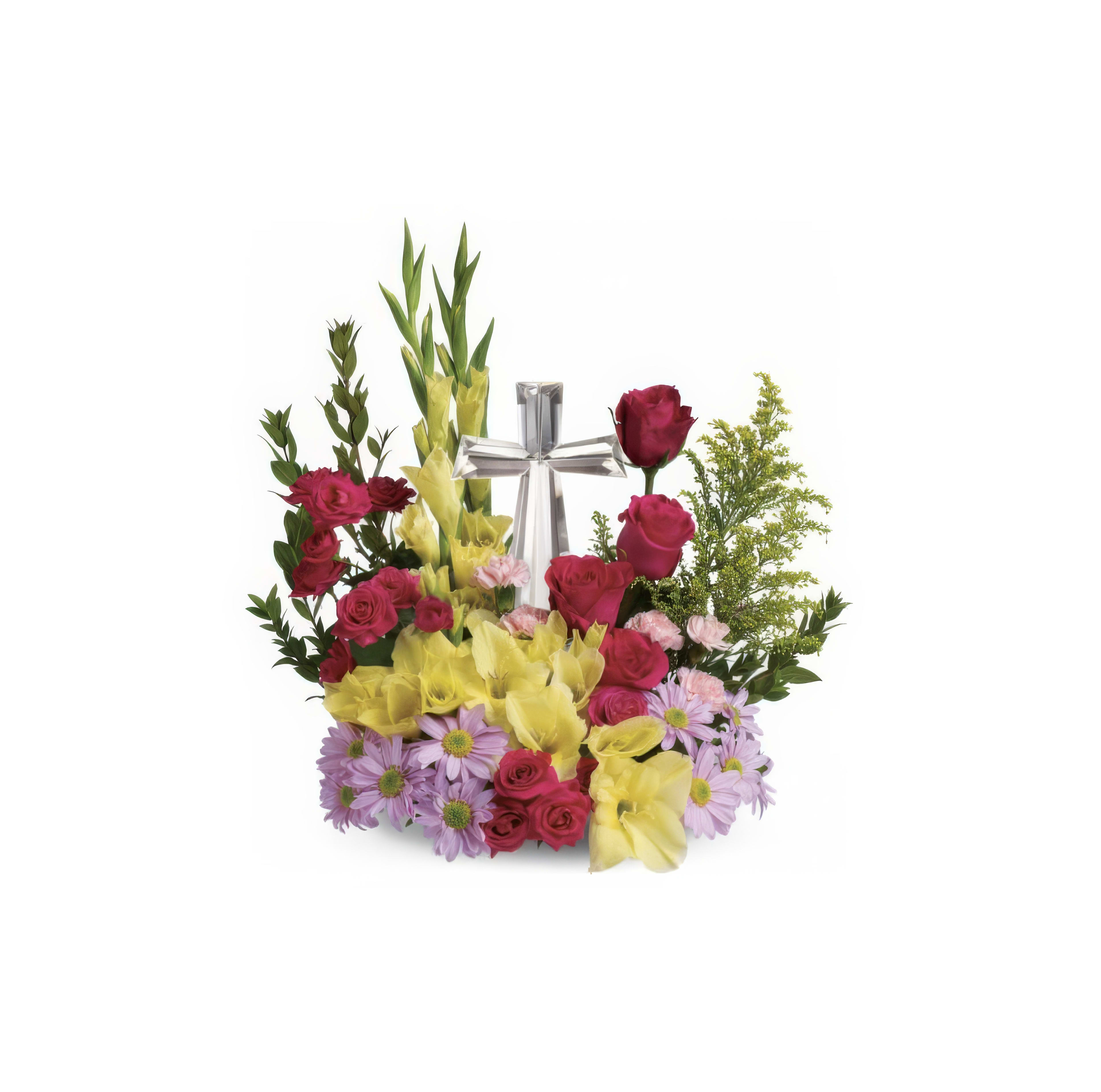 Brightly colored flowers surround a silver cross, creating a heartfelt tribute for remembrance.