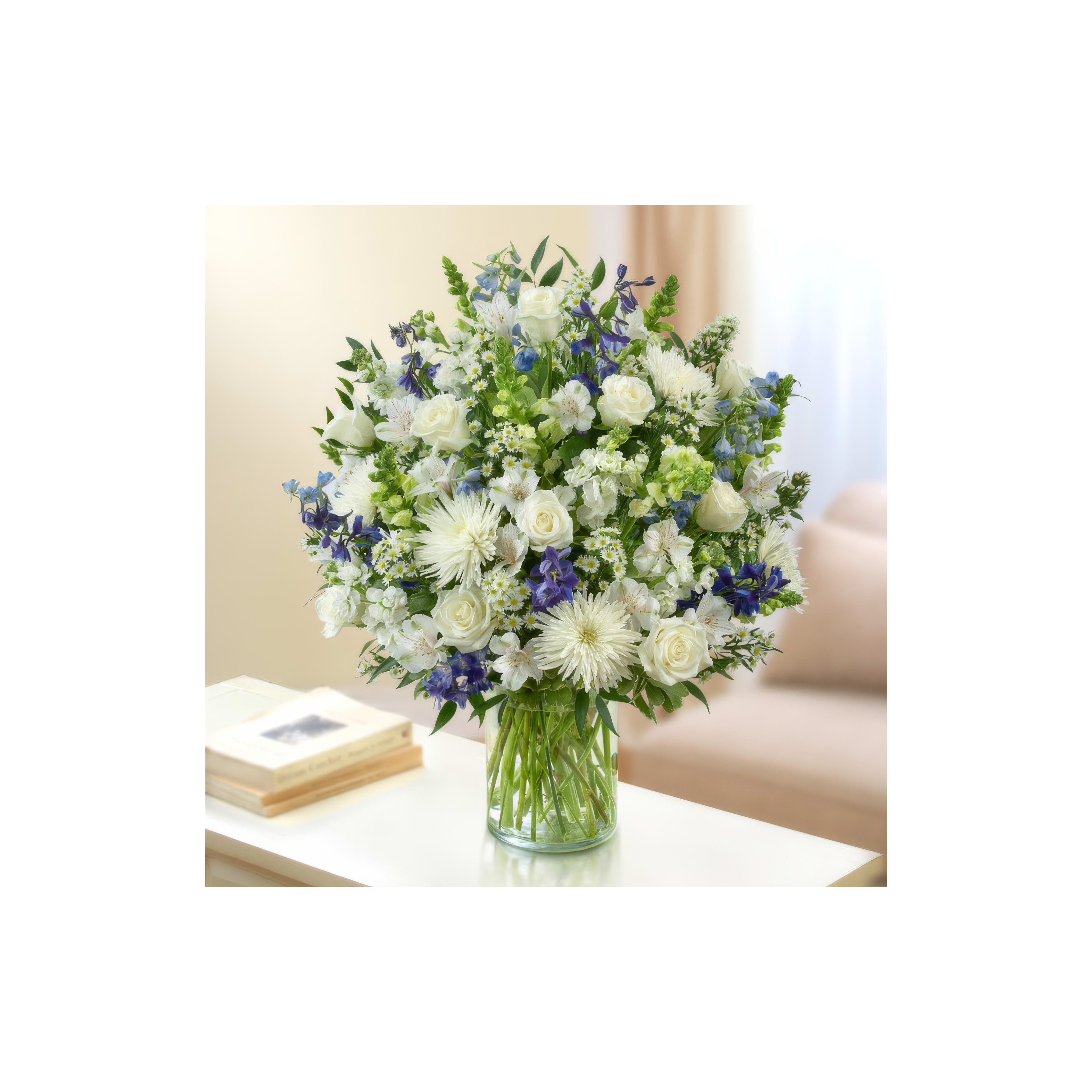 A stunning arrangement of white and blue flowers brightens a cozy living room.