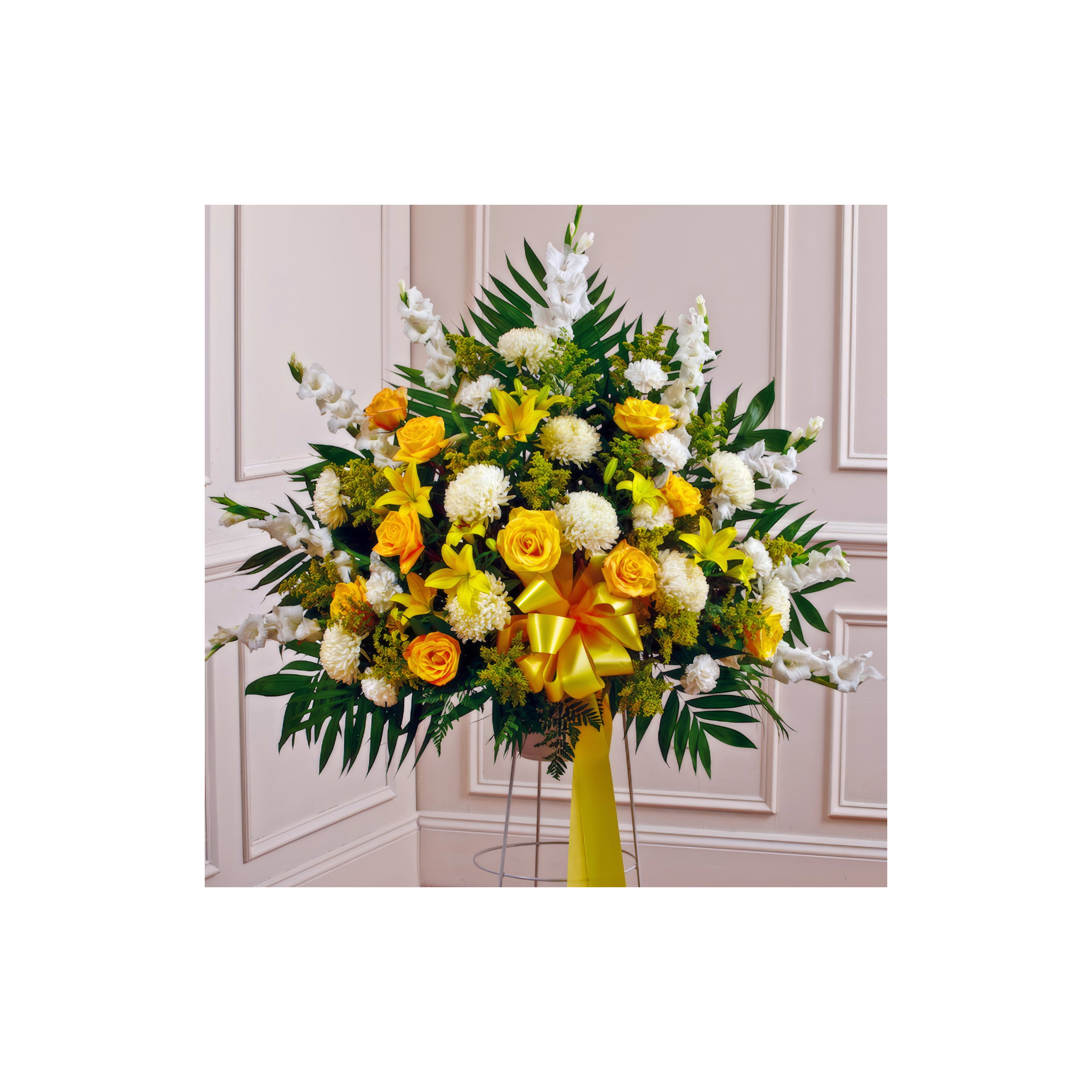 Vibrant bouquet arranged with yellow roses, white lilies, and green foliage for a celebration.