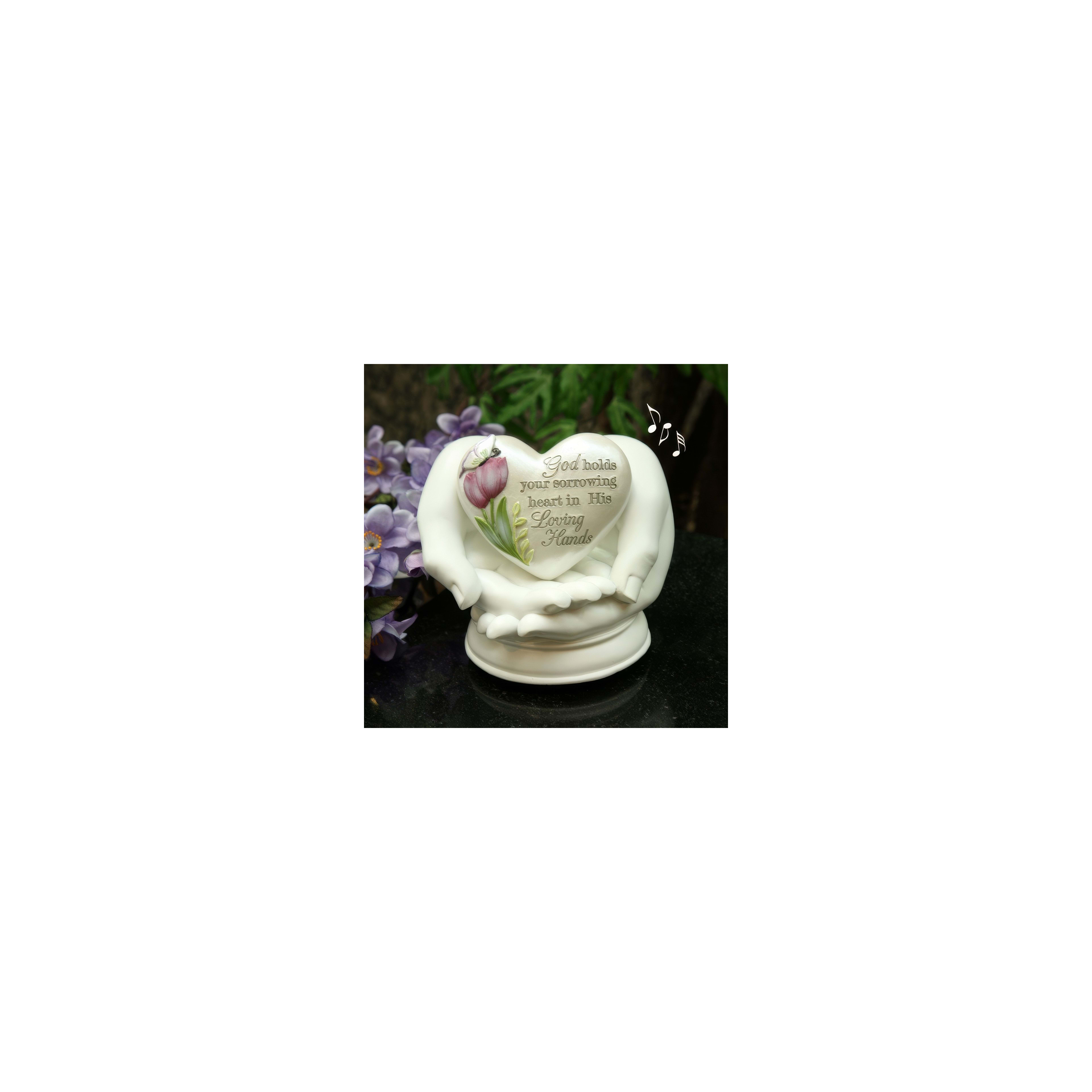 A serene heart figurine with a floral design highlights God's comfort in difficult times.