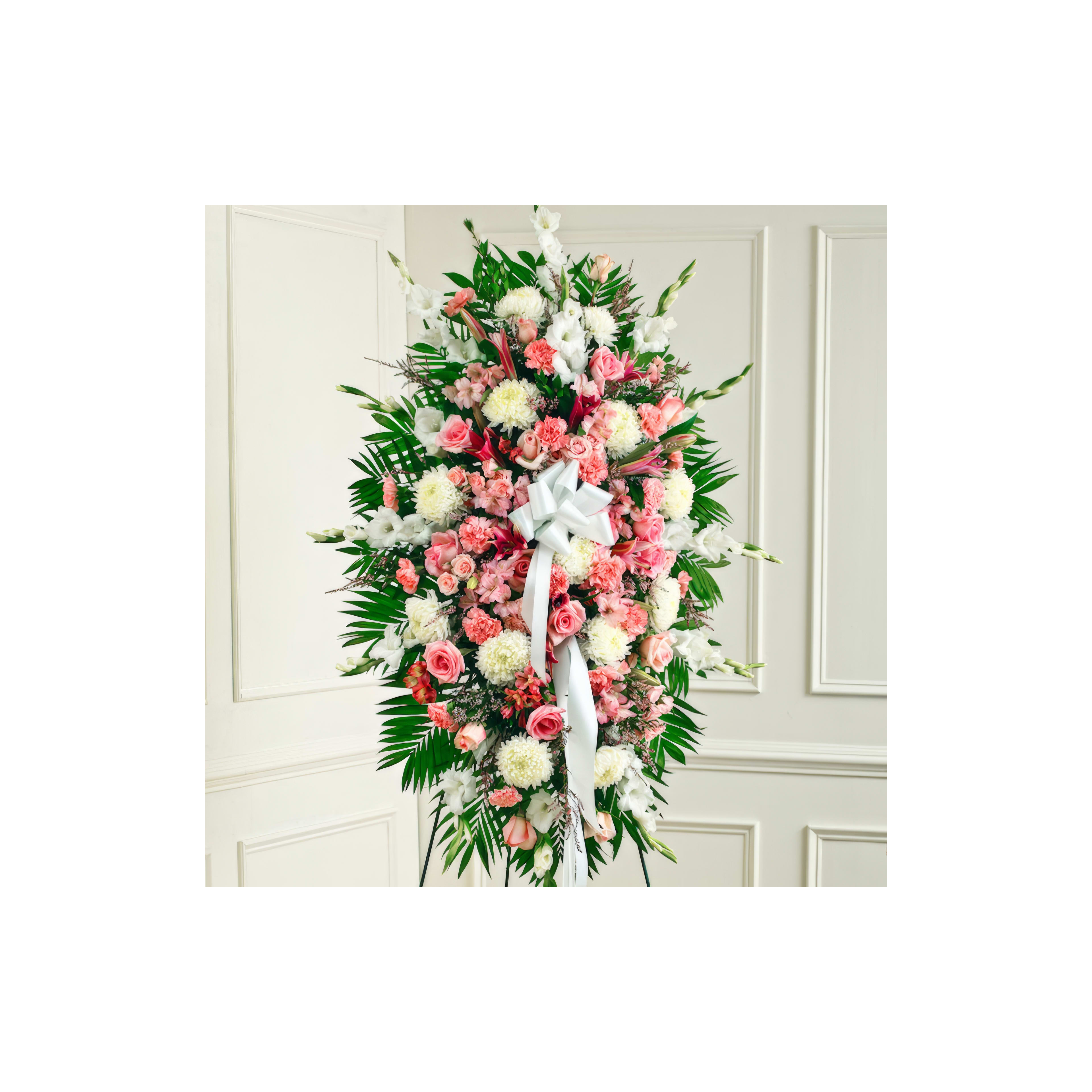 A vibrant arrangement features pink and white flowers, perfect for celebrating a special event.
