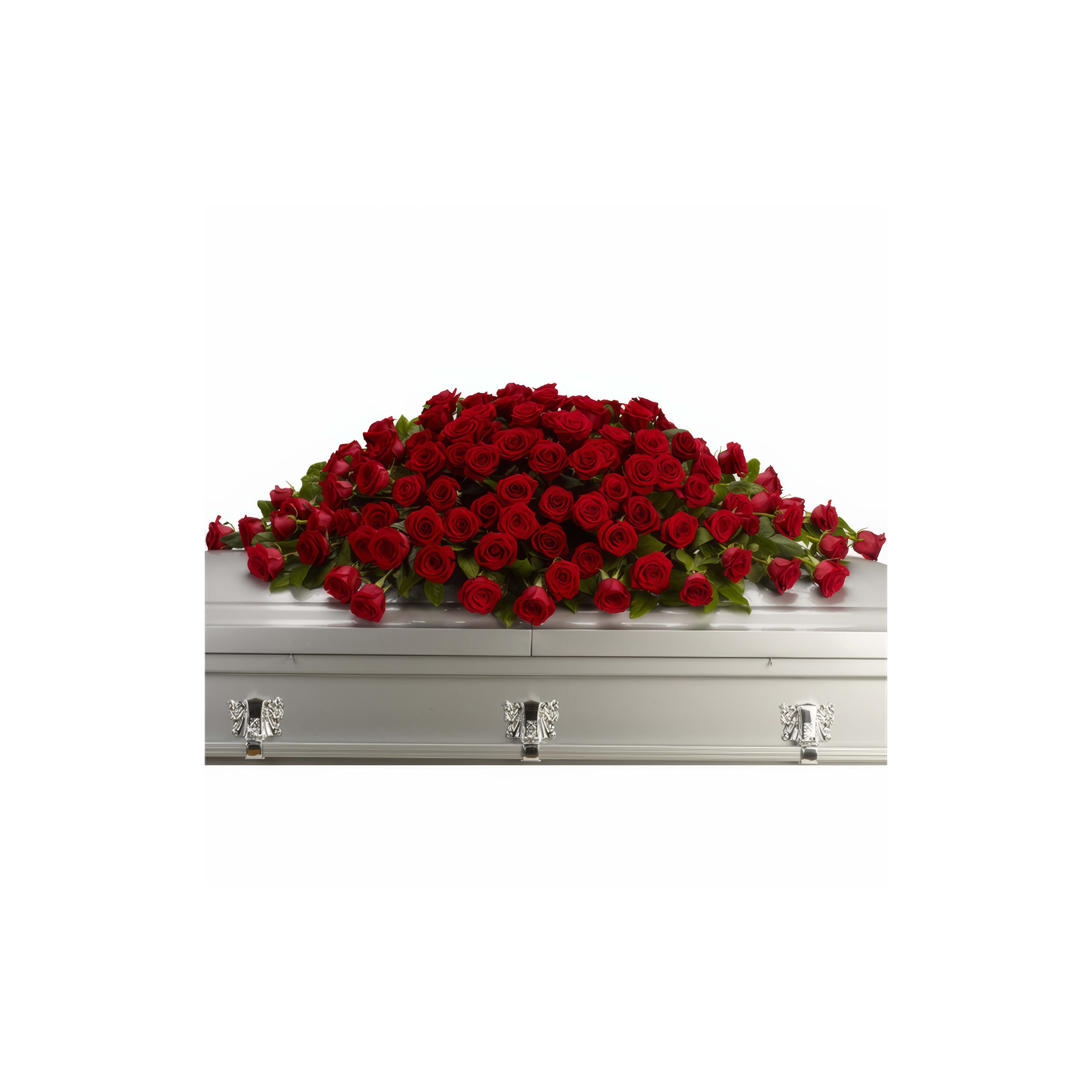 A silver casket is beautifully decorated with vibrant red roses, creating a heartfelt tribute.