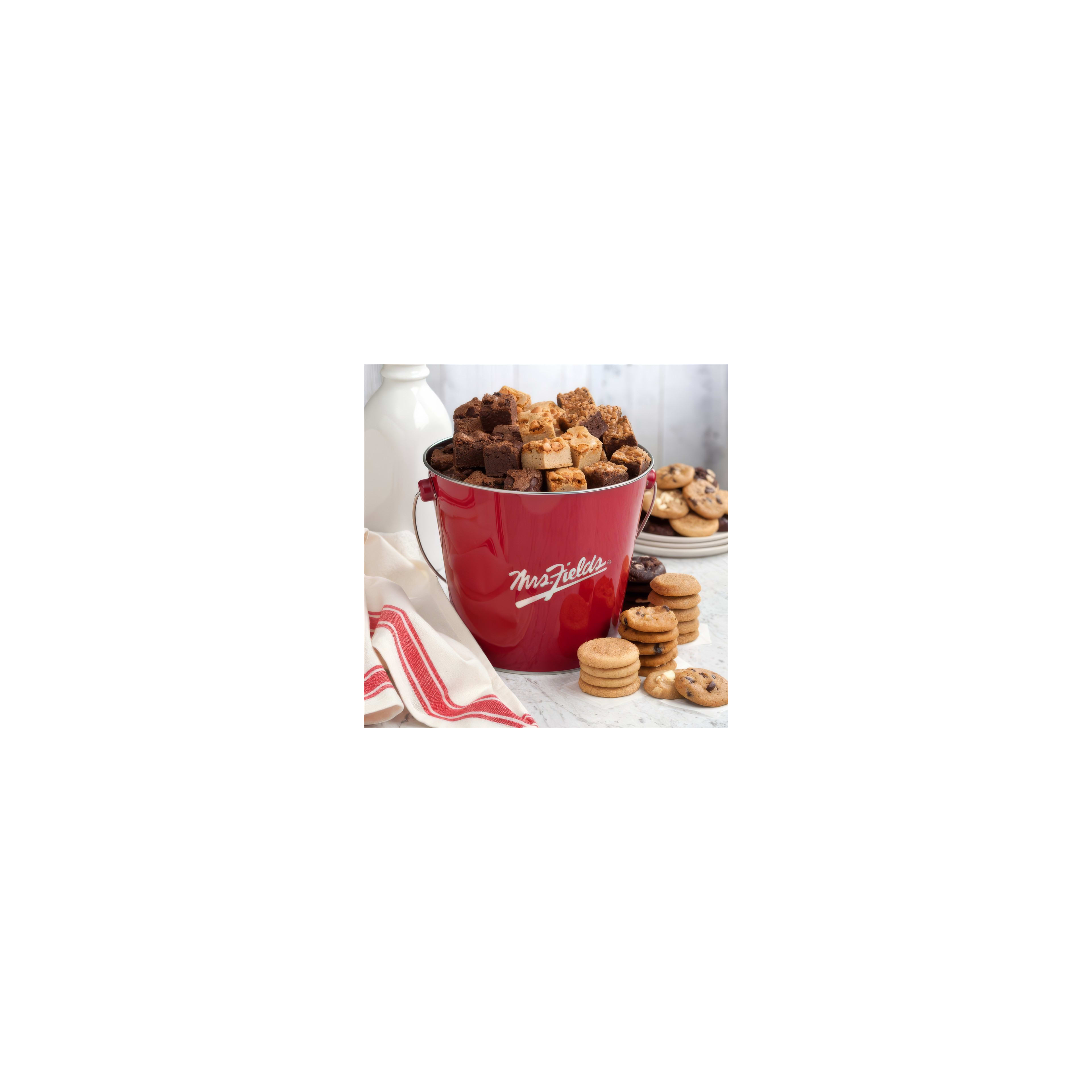A festive red bucket filled with various cookies and brownies sits on a table ready for enjoyment.