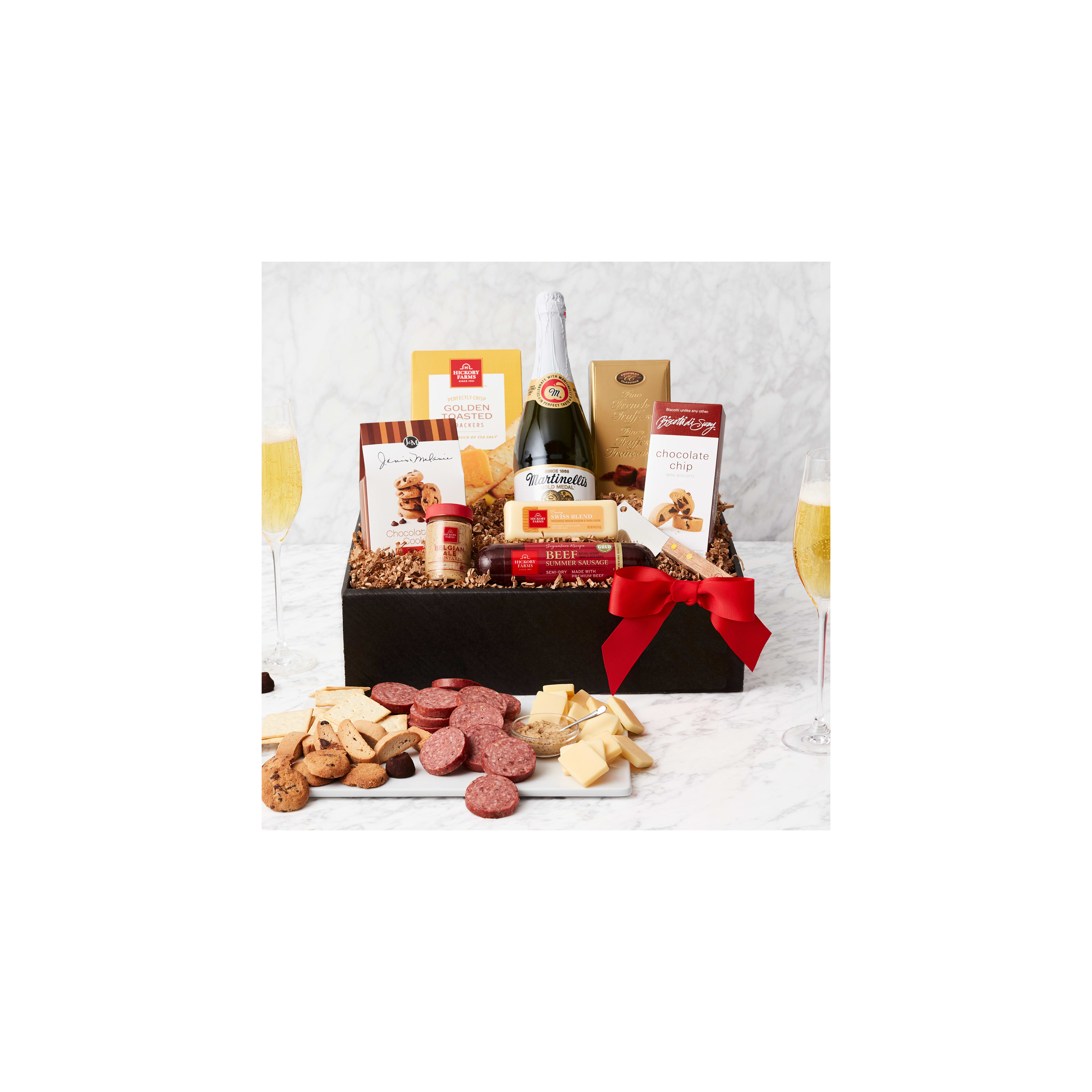 A lovely gift basket of snacks, a drink, and sweets for festive occasions.