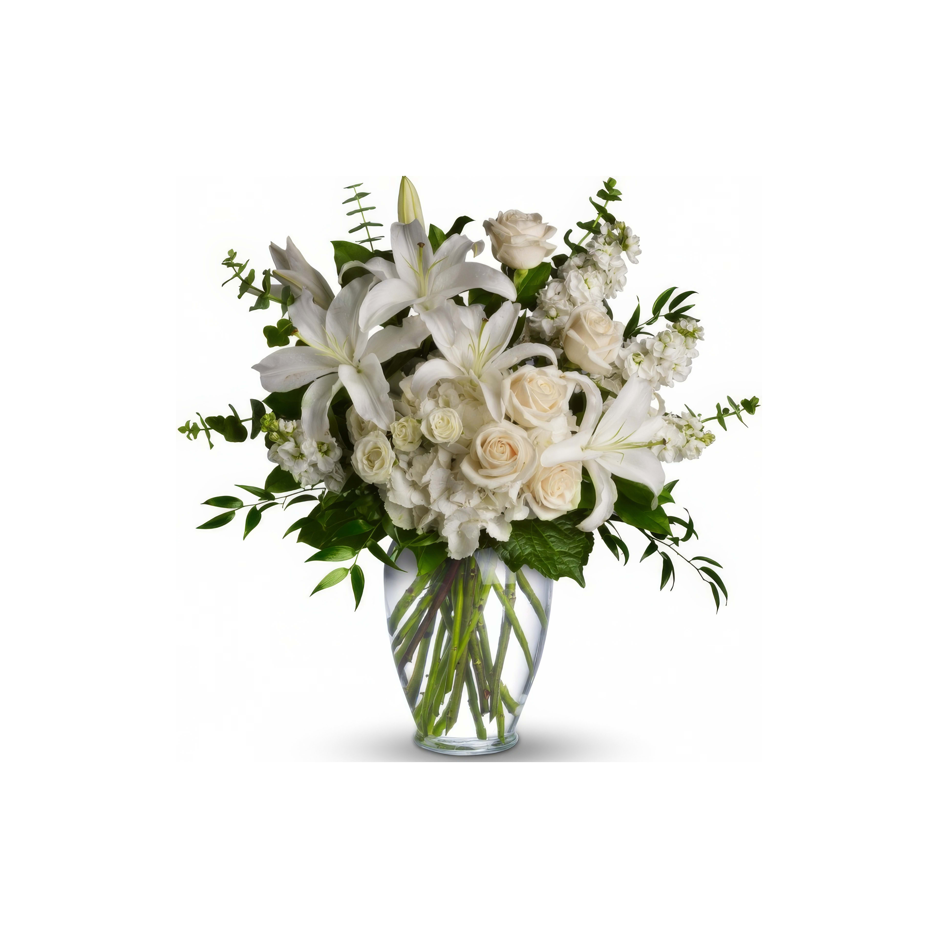 A beautiful assortment of white flowers in a clear vase creates a refined and serene atmosphere.