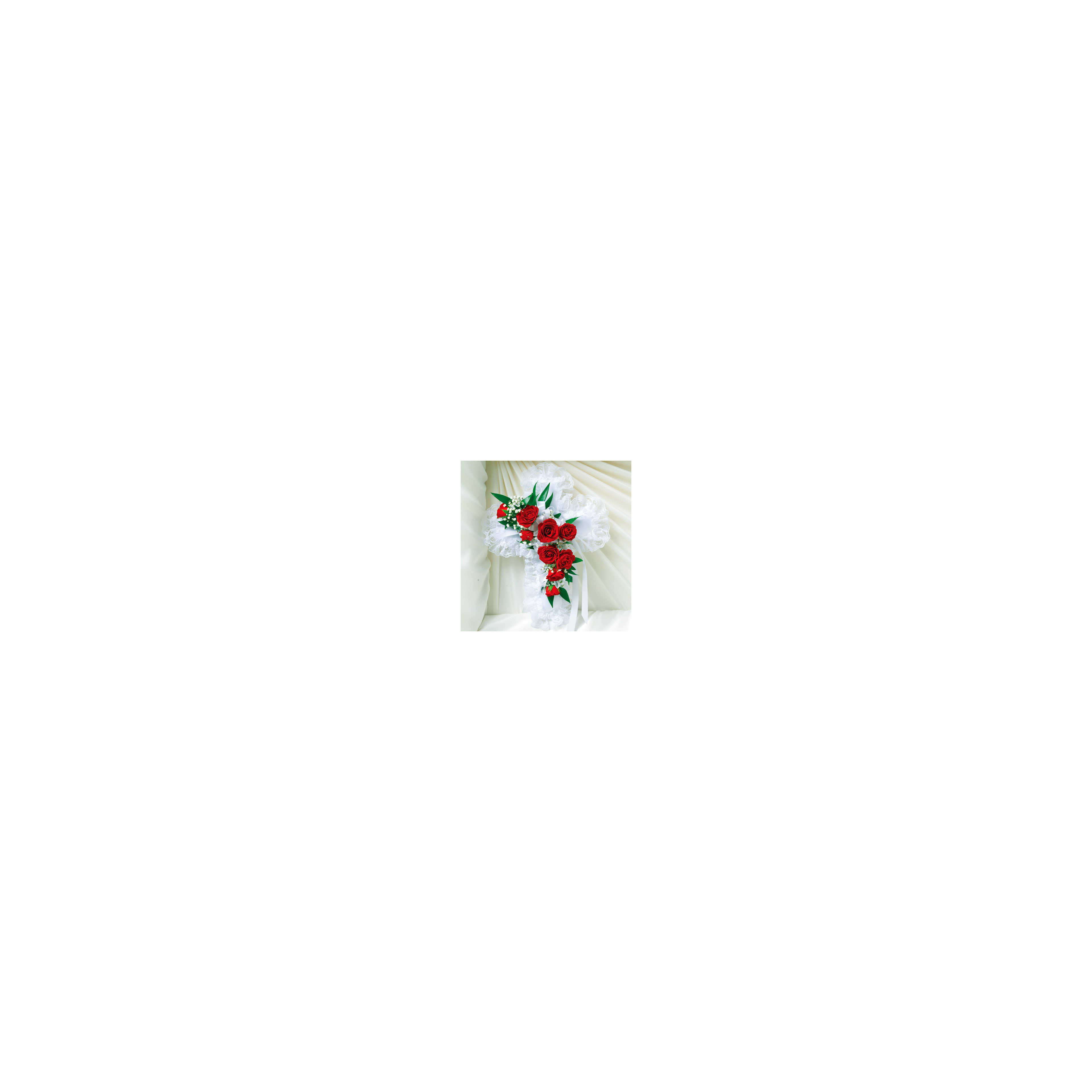 A white fabric cross adorned with red roses and greenery, enhancing its elegance.