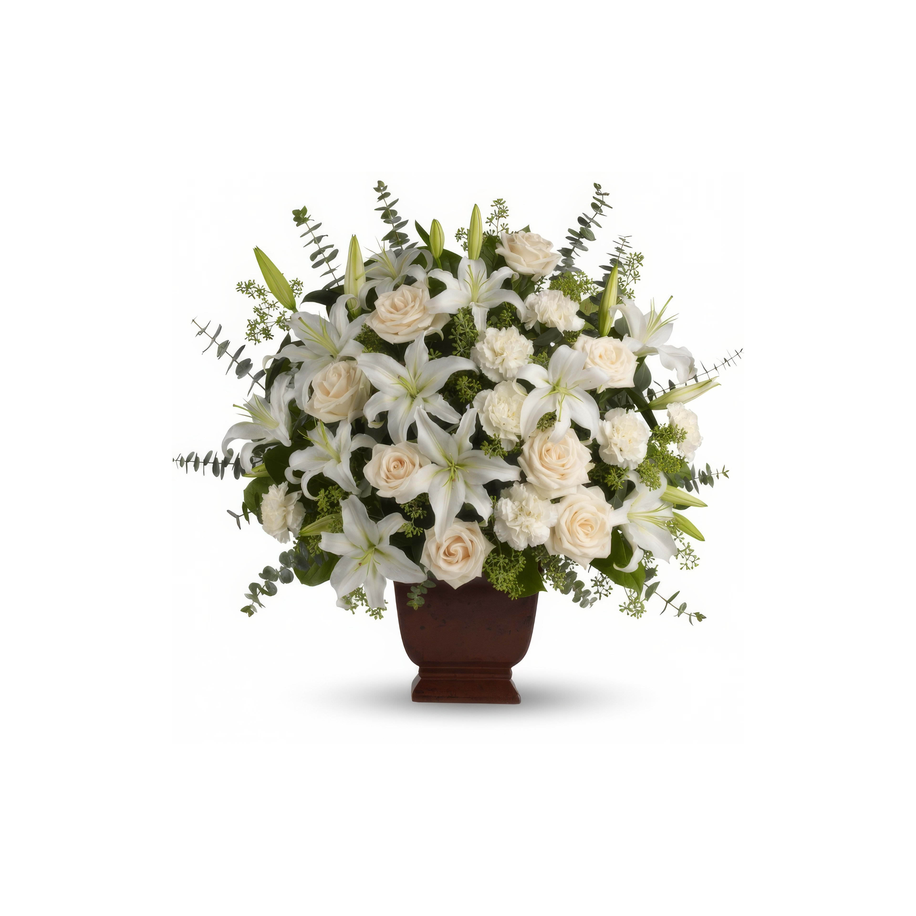 A beautiful arrangement of white lilies and roses in a stylish vase, perfect for spring occasions.