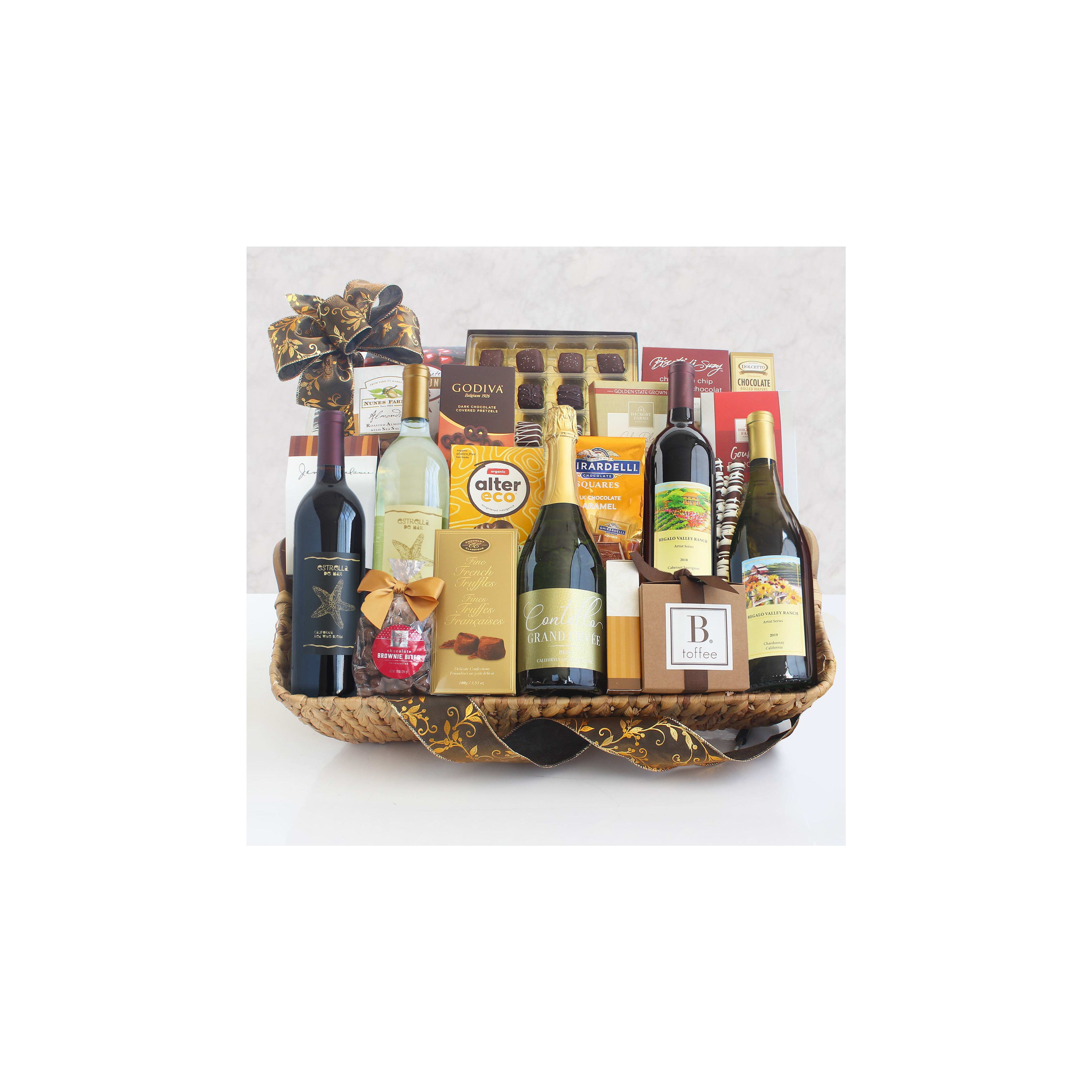 A beautifully arranged gift basket containing various wines, chocolates, and gourmet snacks.