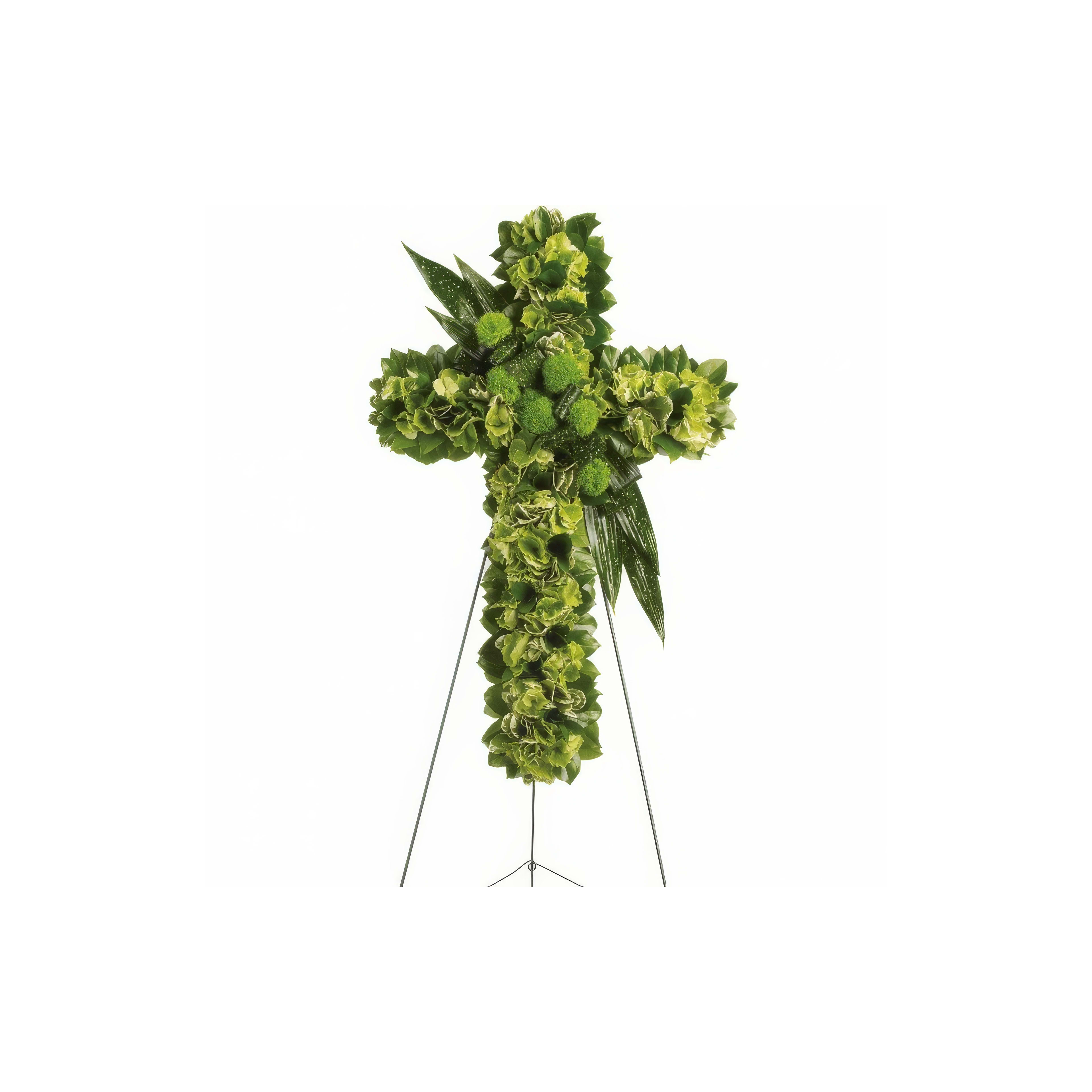 A bright green floral cross on a tripod symbolizes remembrance at a somber occasion.