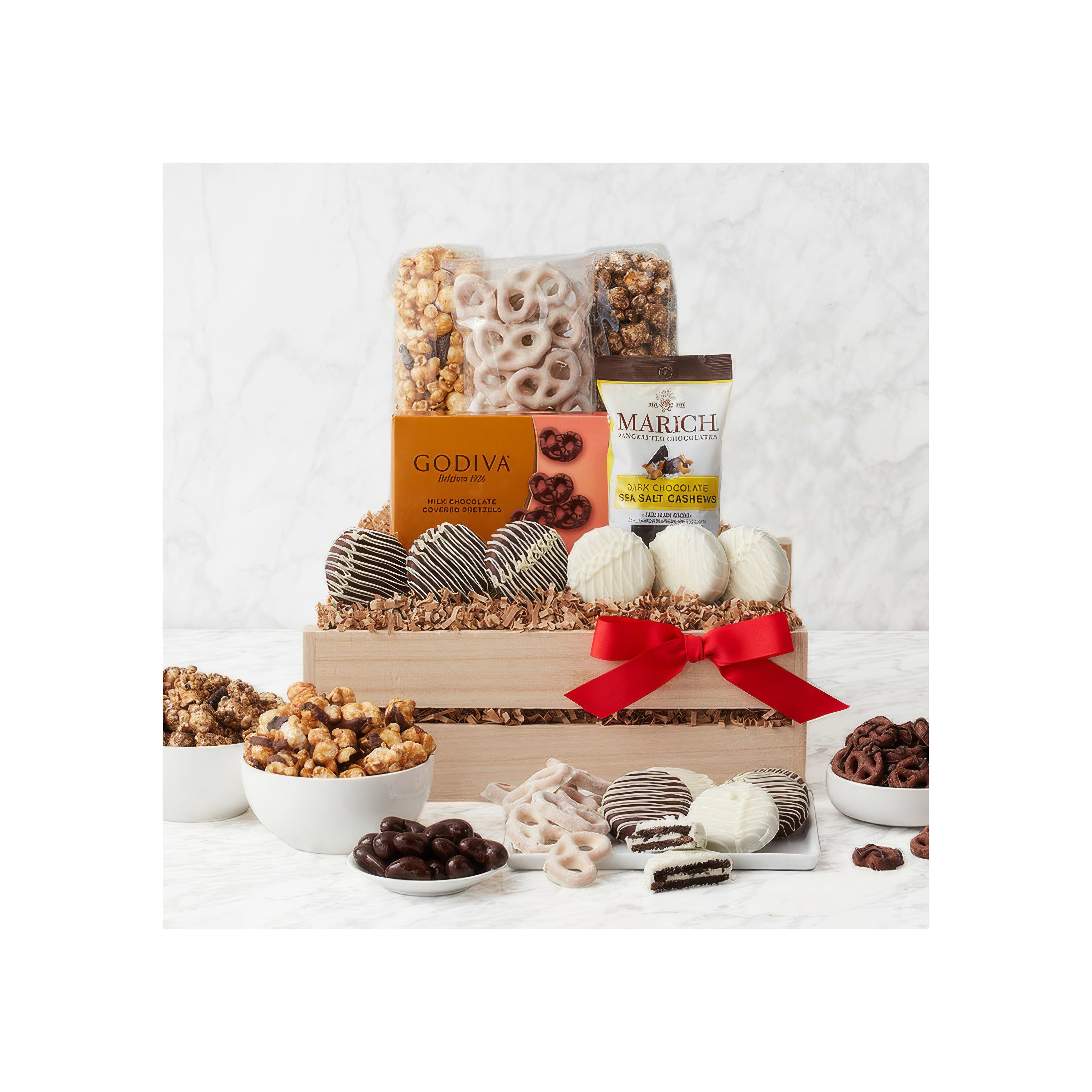 A variety of sweets and snacks are artistically arranged in a wooden box, perfect for gifting.