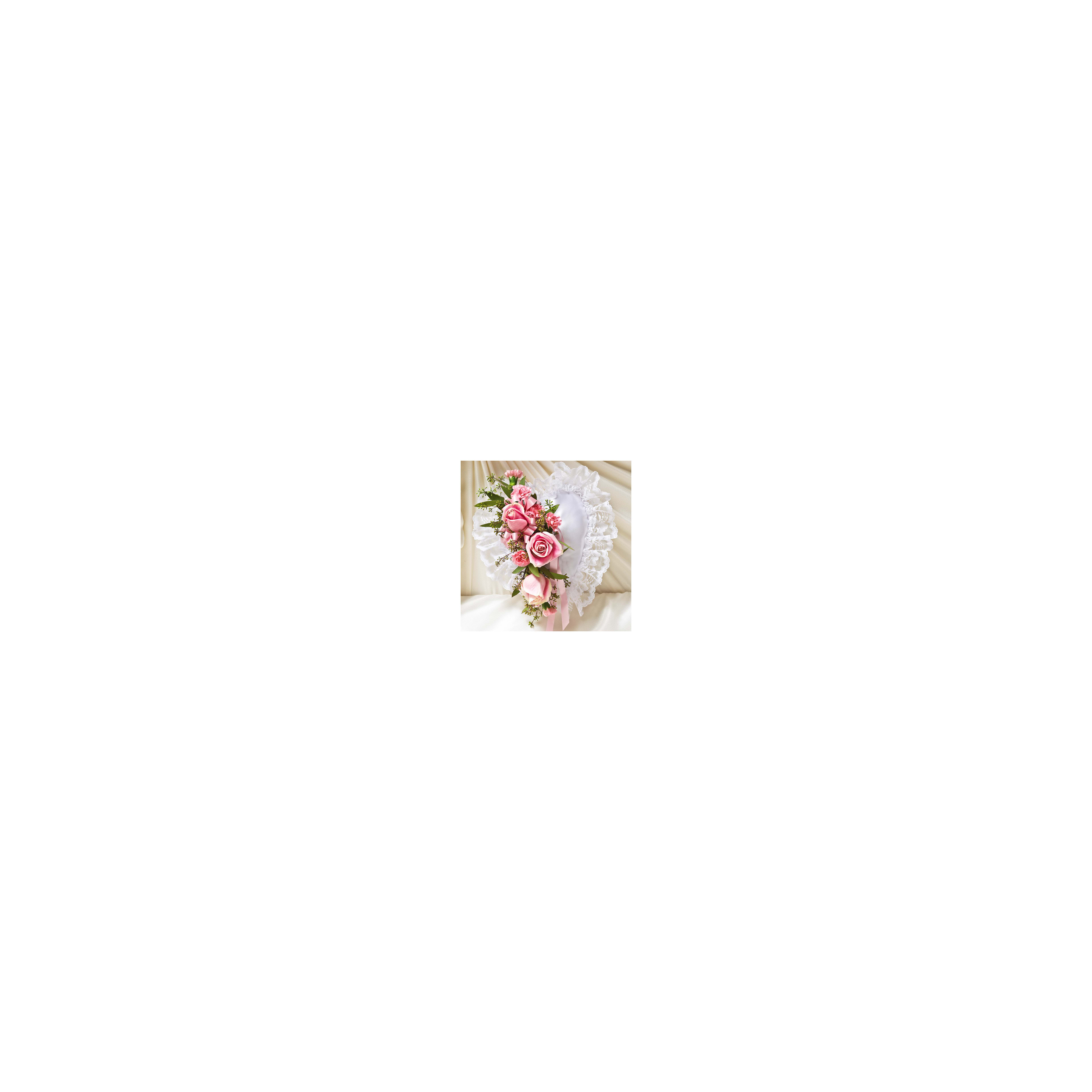 Beautiful heart-shaped floral display features pink roses and lace, perfect for a special event.