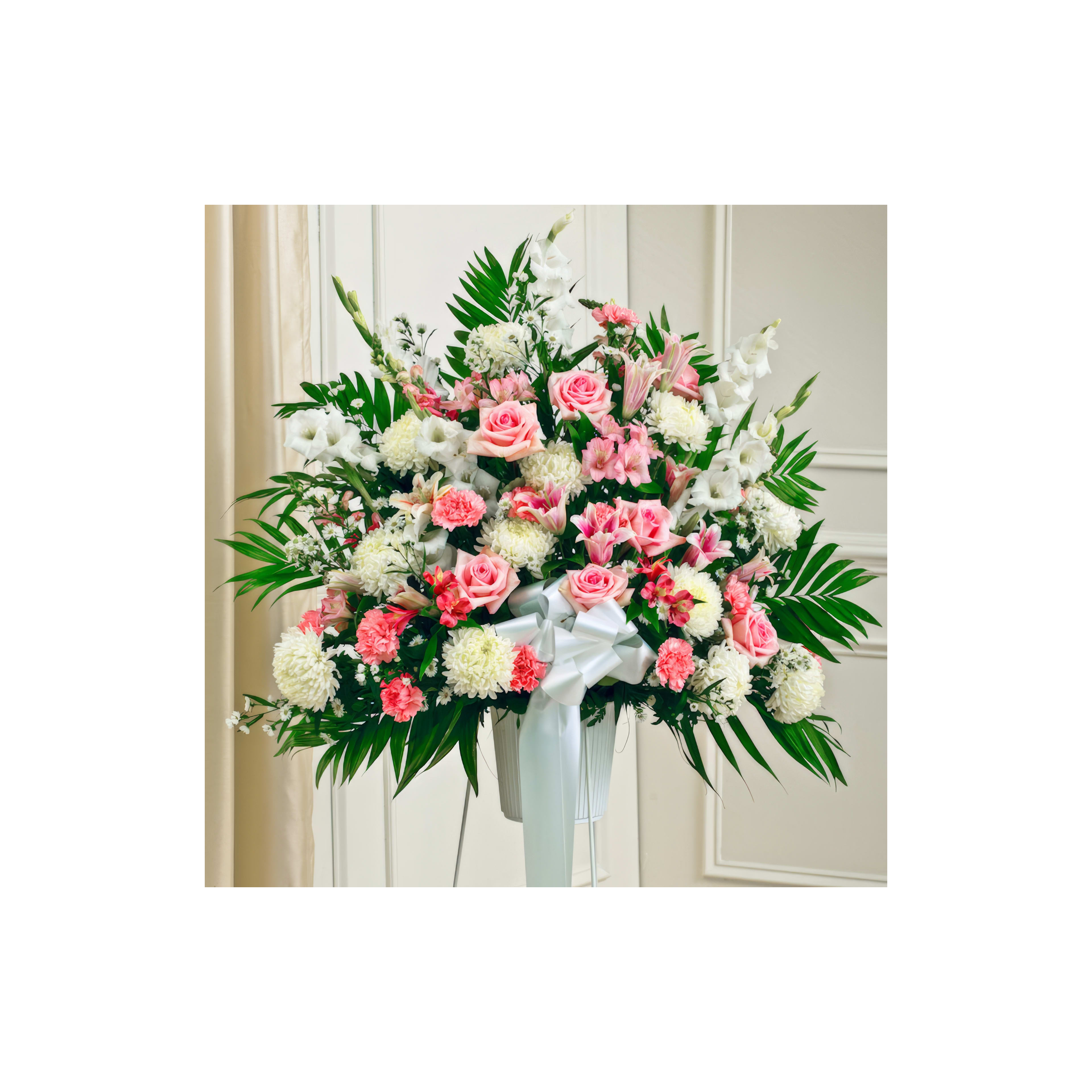 Vibrant bouquet featuring pink roses, white orchids, and greenery enhances event decor.