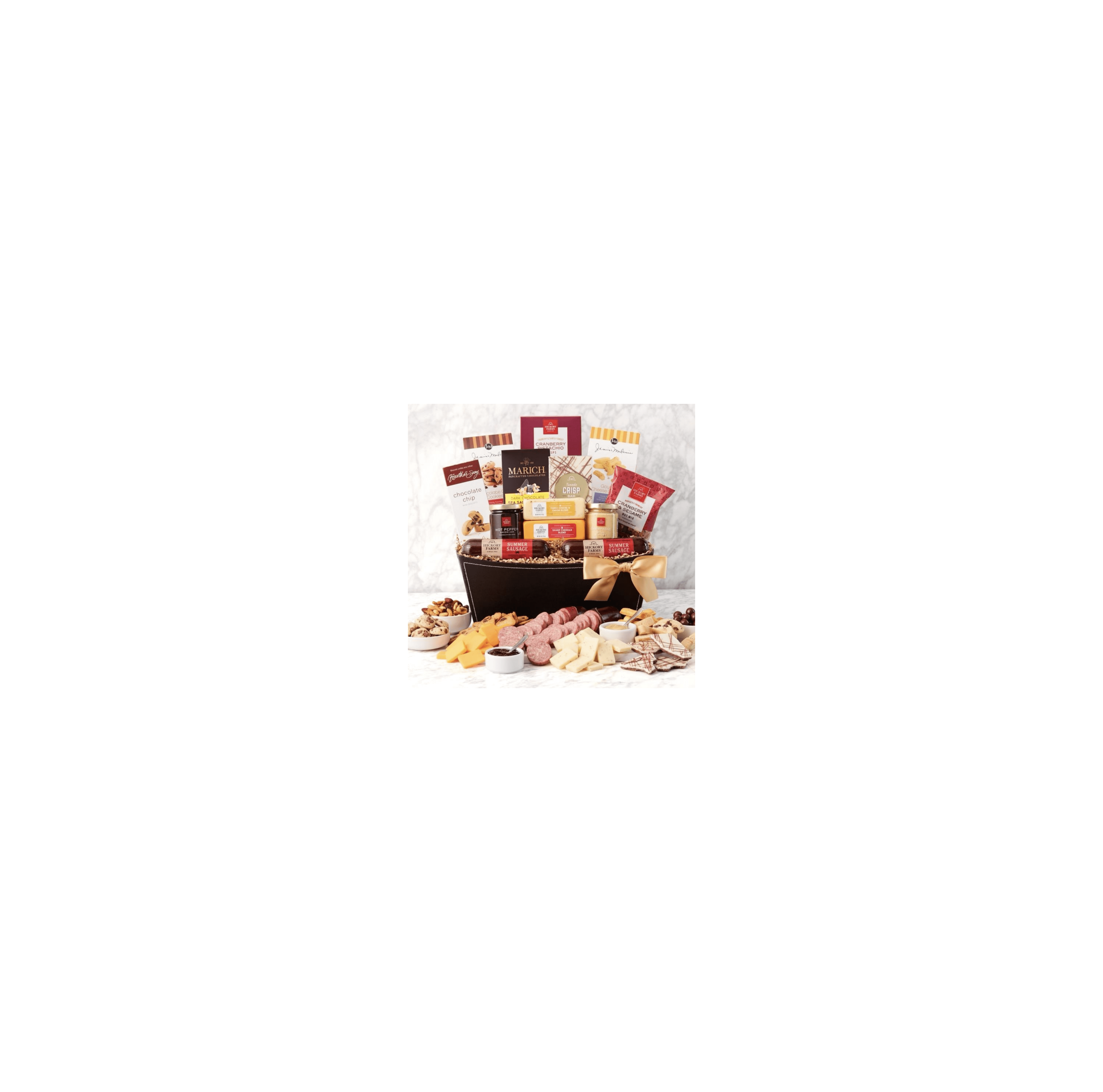A gourmet gift basket features cheeses, cured meats, and sweets, all beautifully arranged.