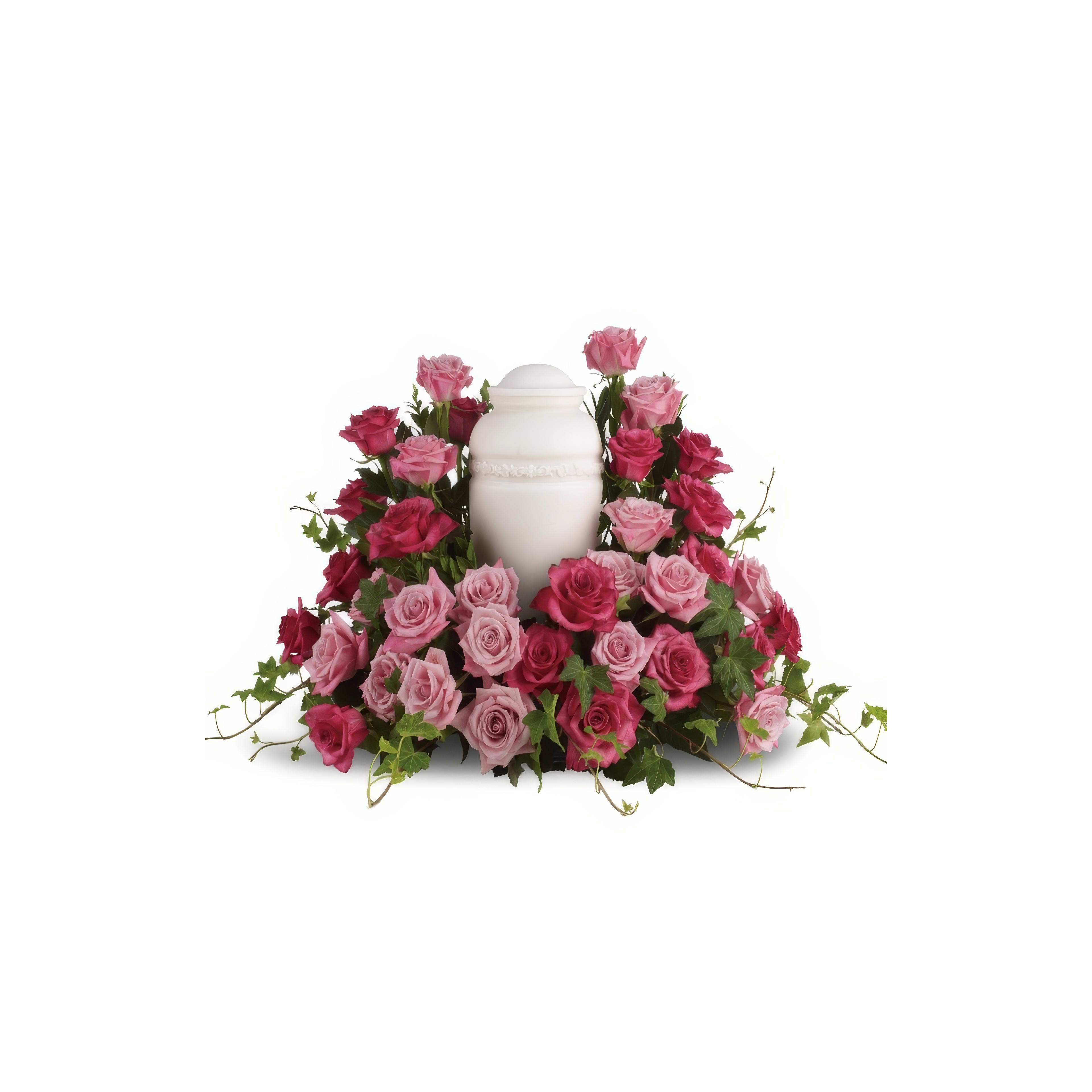 Colorful roses in shades of pink and red surround a white urn, creating a serene tribute.