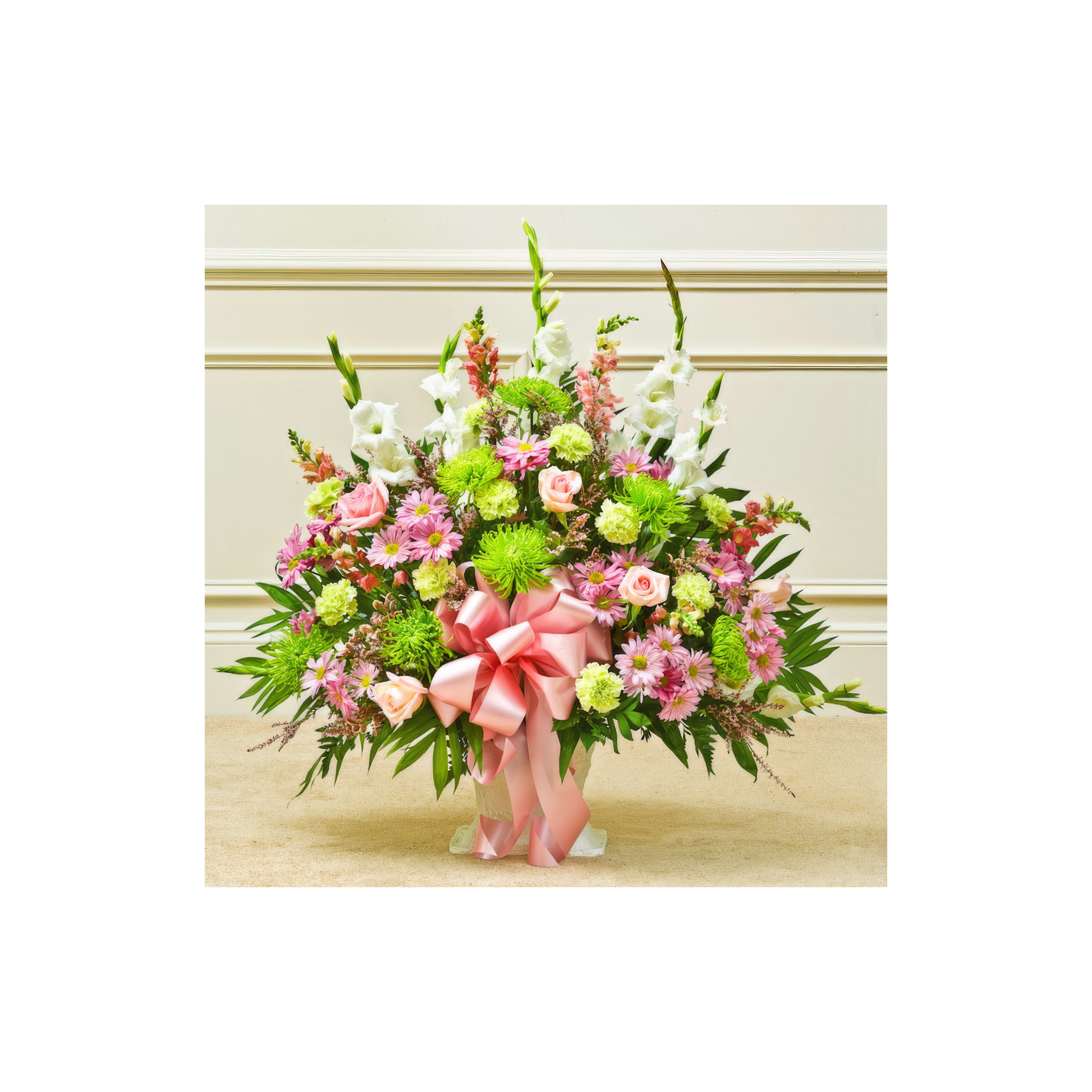 A vibrant mix of pink roses, white lilies, and green accents brightens the venue.