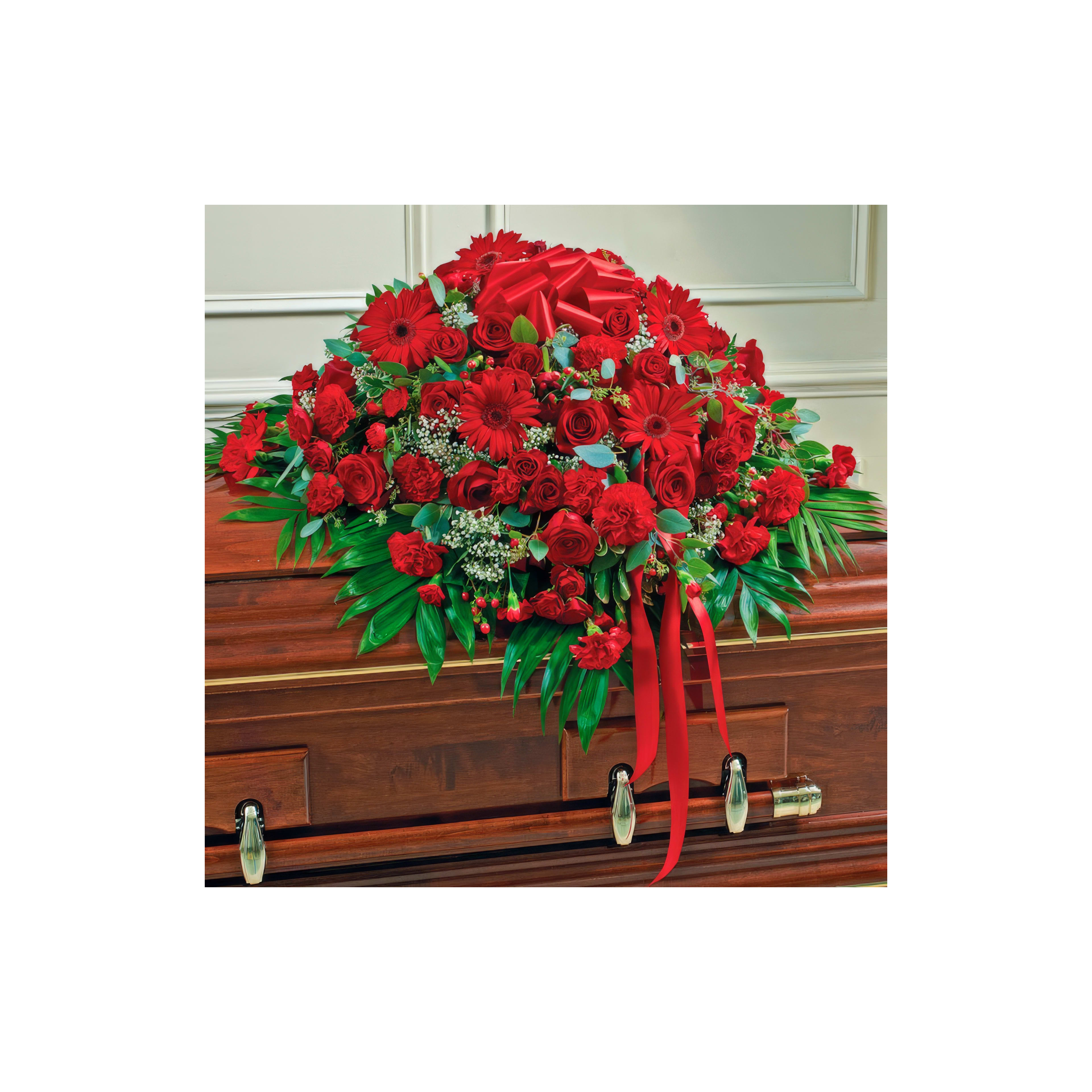 A bright arrangement of red flowers decorates a casket, paying tribute during farewell.